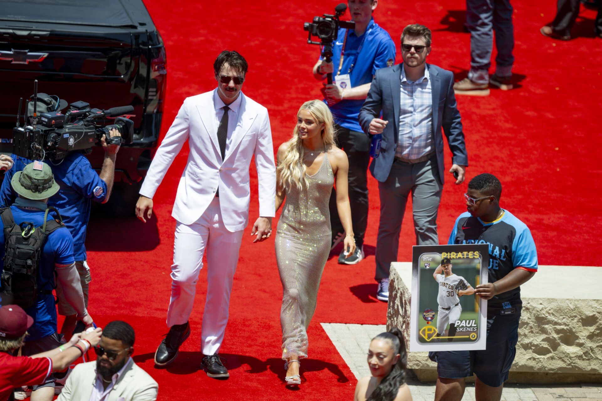 National League pitcher Paul Skenes of the Pittsburgh Pirates walks the red carpet with his girlfriend LSU gymnast Olivia Livvy Dunne before the 2024 MLB All-Star game at Globe Life Field.