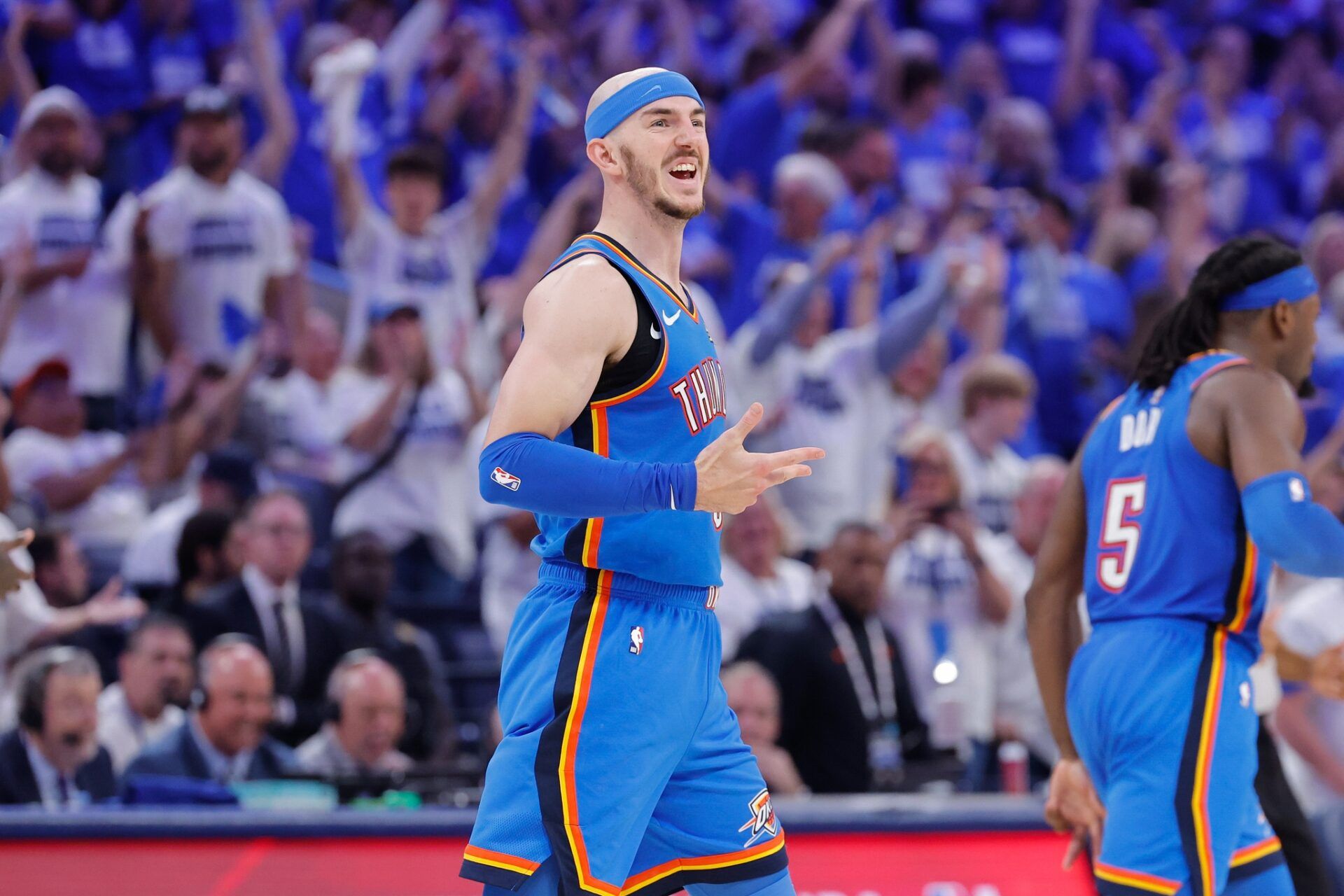 Oklahoma City Thunder guard Alex Caruso (9) celebrates after Oklahoma City Thunder guard Luguentz Dort scores a three point basket against the Minnesota Timberwolves in the fourth quarter during game five of the western conference finals for the 2025 NBA Playoffs at Paycom Center.