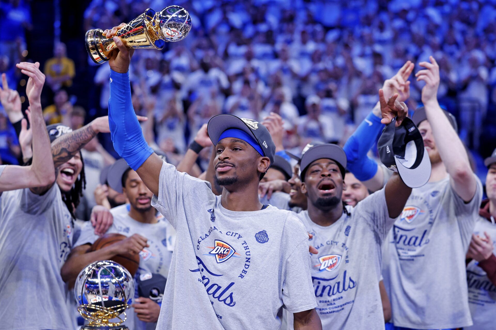 Oklahoma City Thunder guard Shai Gilgeous-Alexander (2) celebrates with Magic Johnson West Conference Finals MVP trophy after defeating the Minnesota Timberwolves in game five to win the western conference finals for the 2025 NBA Playoffs at Paycom Center.