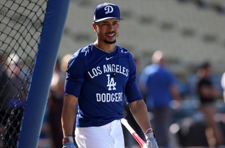 Los Angeles Dodgers shortstop Mookie Betts (50) warms up before a game against the New York Mets at Dodger Stadium.