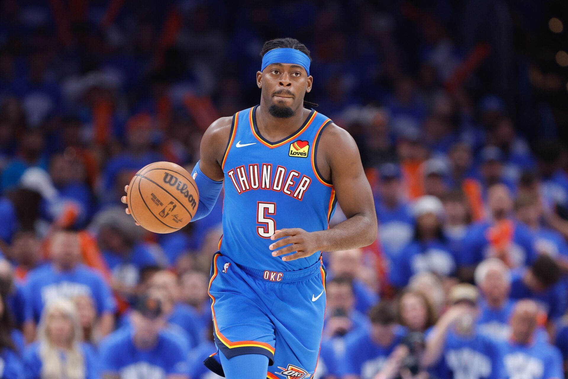 Oklahoma City Thunder guard Luguentz Dort (5) dribbles down the court against the Denver Nuggets in the second half during game seven of the second round for the 2025 NBA Playoffs at Paycom Center.