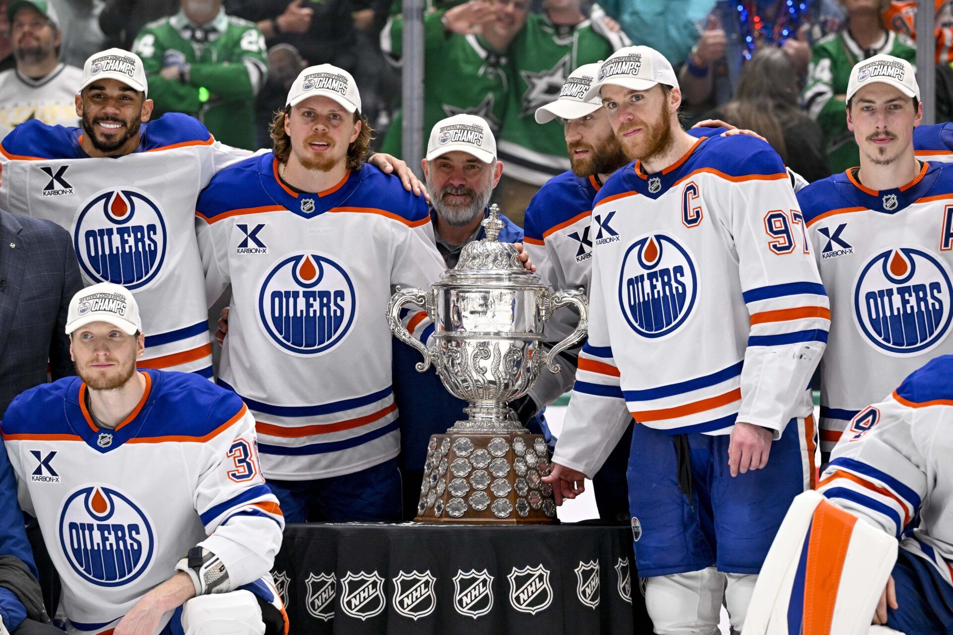 The Edmonton Oilers pose with the Clarence S. Campbell Bowl after the game between the Dallas Stars and the Edmonton Oilers in game five of the Western Conference Final of the 2025 Stanley Cup Playoffs at American Airlines Center.