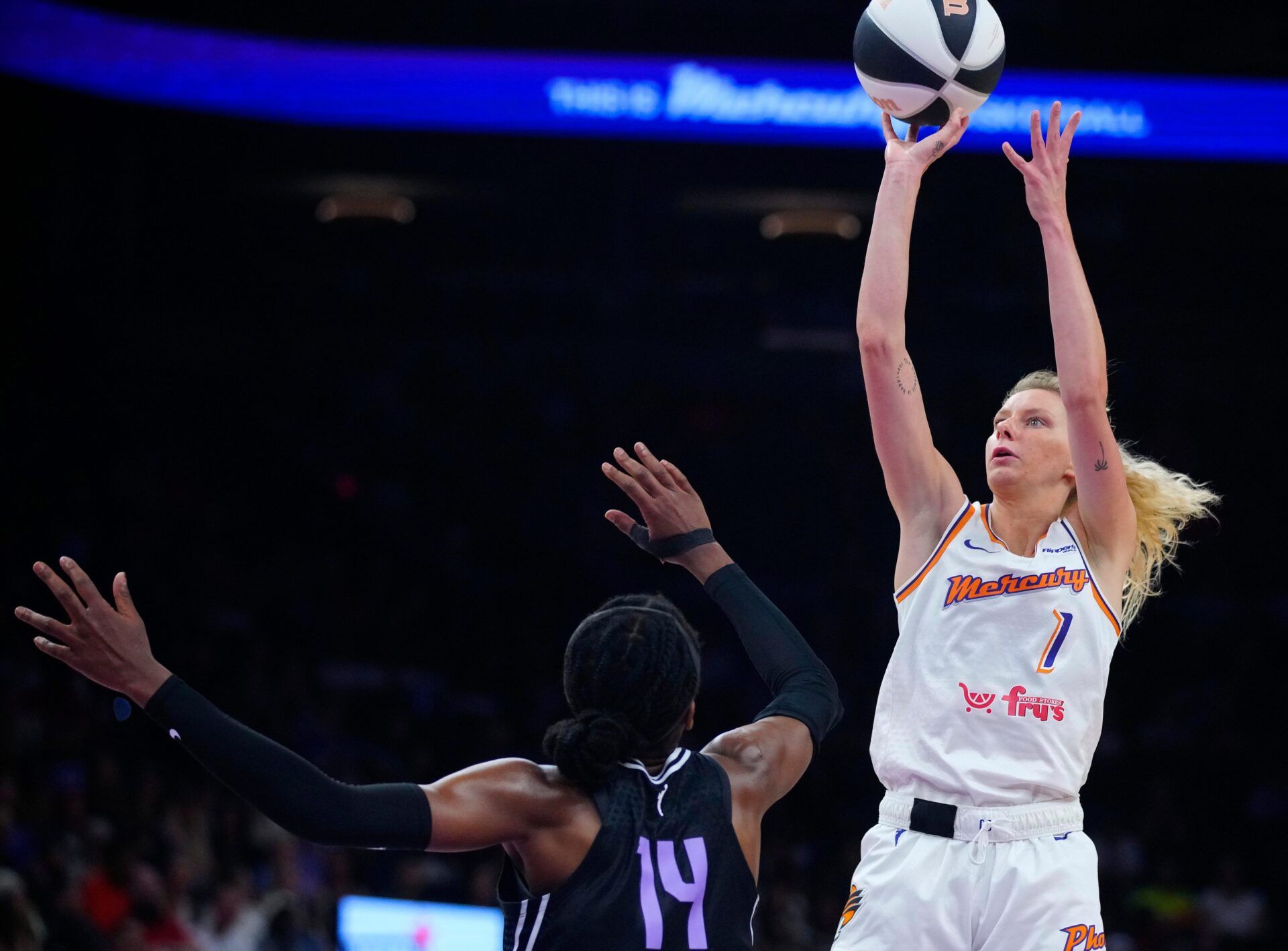 Mercury guard Lexi Held (1) shoots against Valkyries forward Teri Fagbenle (14) during a game at PHX Arena in Phoenix, on June 5, 2025.