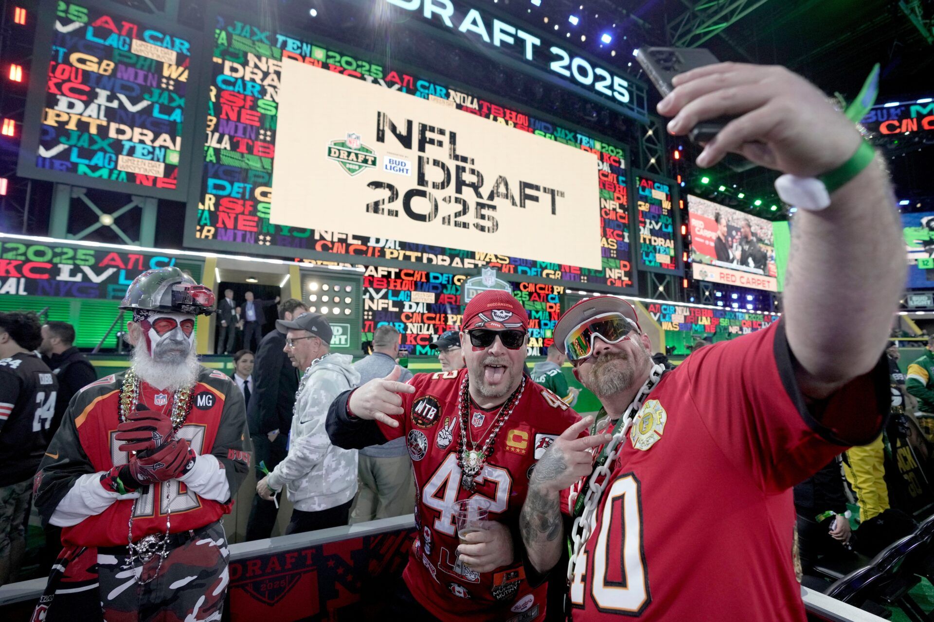 Tampa Bay Buccaneer fans do selfies before the start of the first round of the NFL Draft Thursday, April 24, 2025 in Green Bay, Wisconsin. It is the first time the draft will be held in Green Bay, the smallest market in the National Football League.