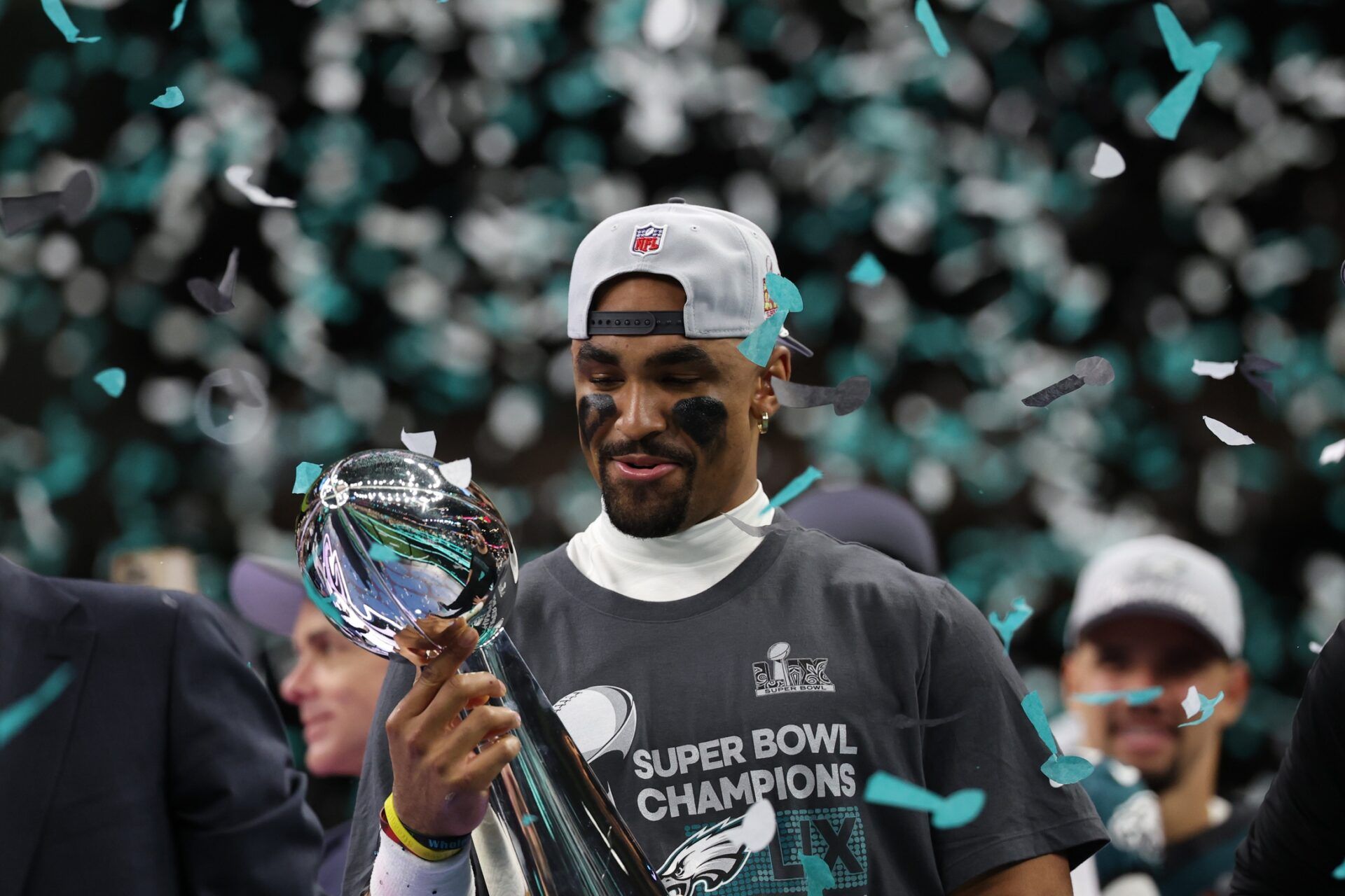 Philadelphia Eagles quarterback Jalen Hurts holds the Lombardi Trophy during the championship trophy presentation after the Eagles' game against the Kansas City Chiefs in Super Bowl LIX at Caesars Superdome.