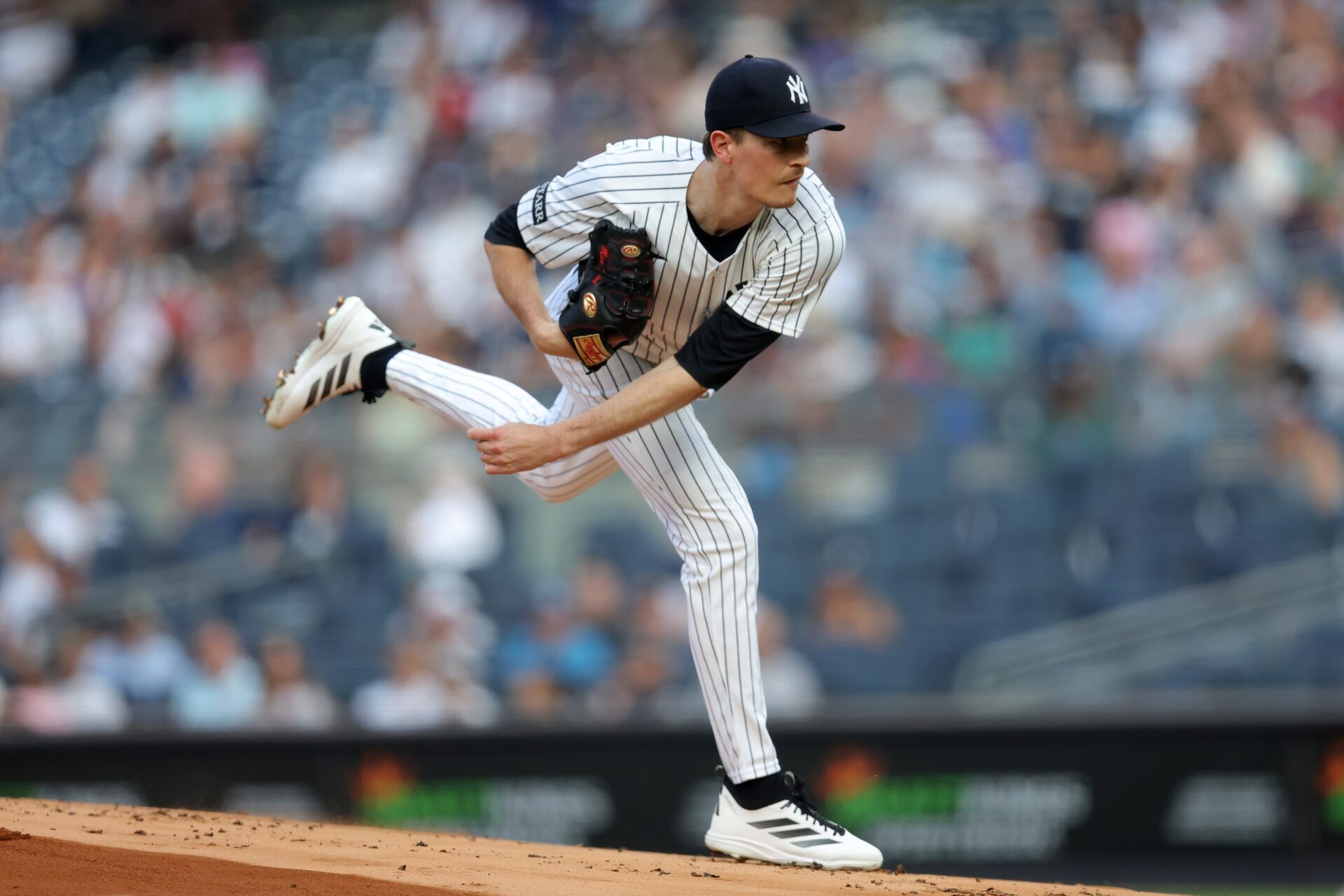 New York Yankees starting pitcher Max Fried (54) follows through on a pitch against the Cleveland Guardians during the first inning at Yankee Stadium.