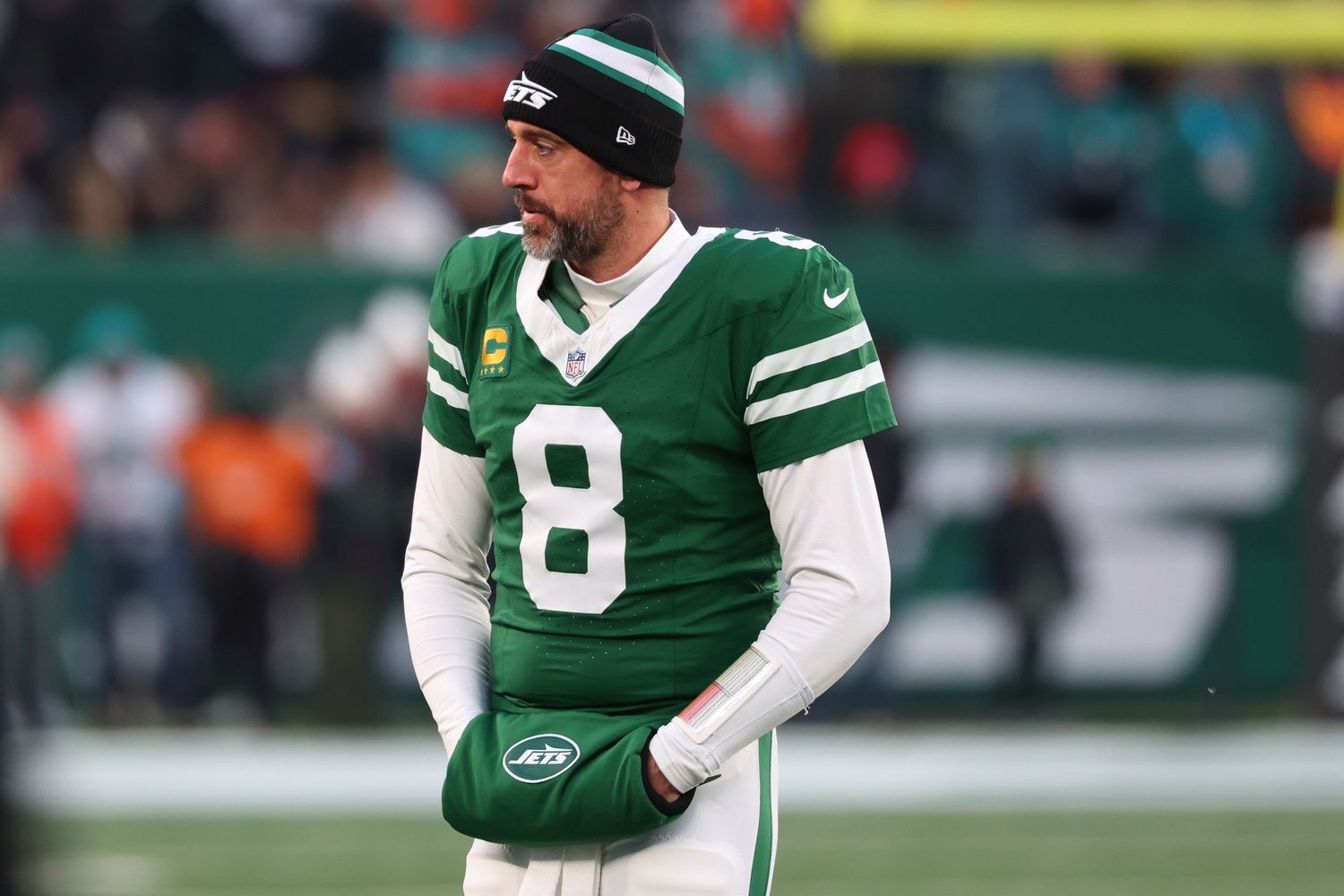New York Jets quarterback Aaron Rodgers (8) looks on during the first quarter of their game against the Miami Dolphins at MetLife Stadium.