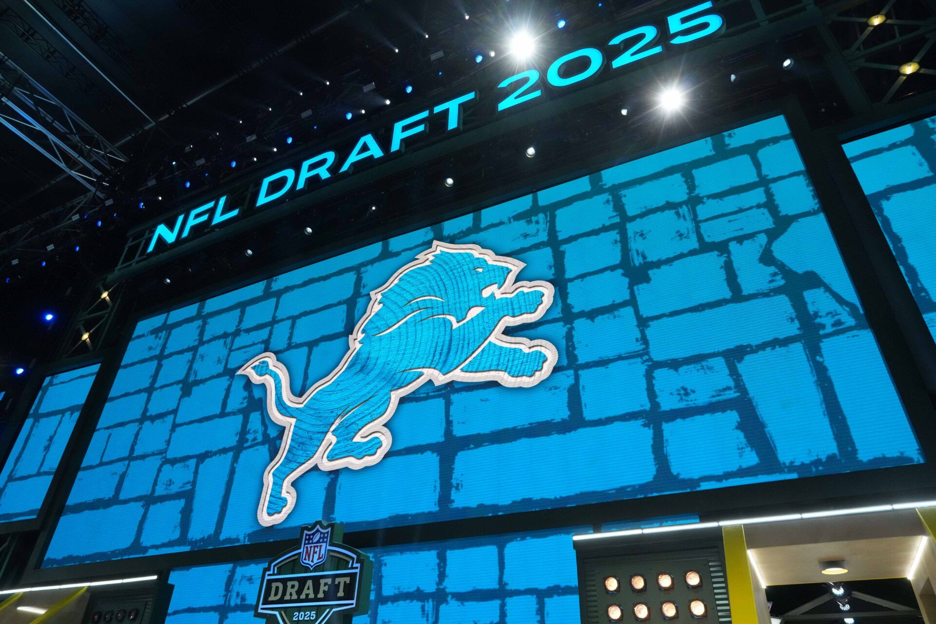 The Detroit Lions logo is projected on the video board during the NFL Draft at Lambeau Field.
