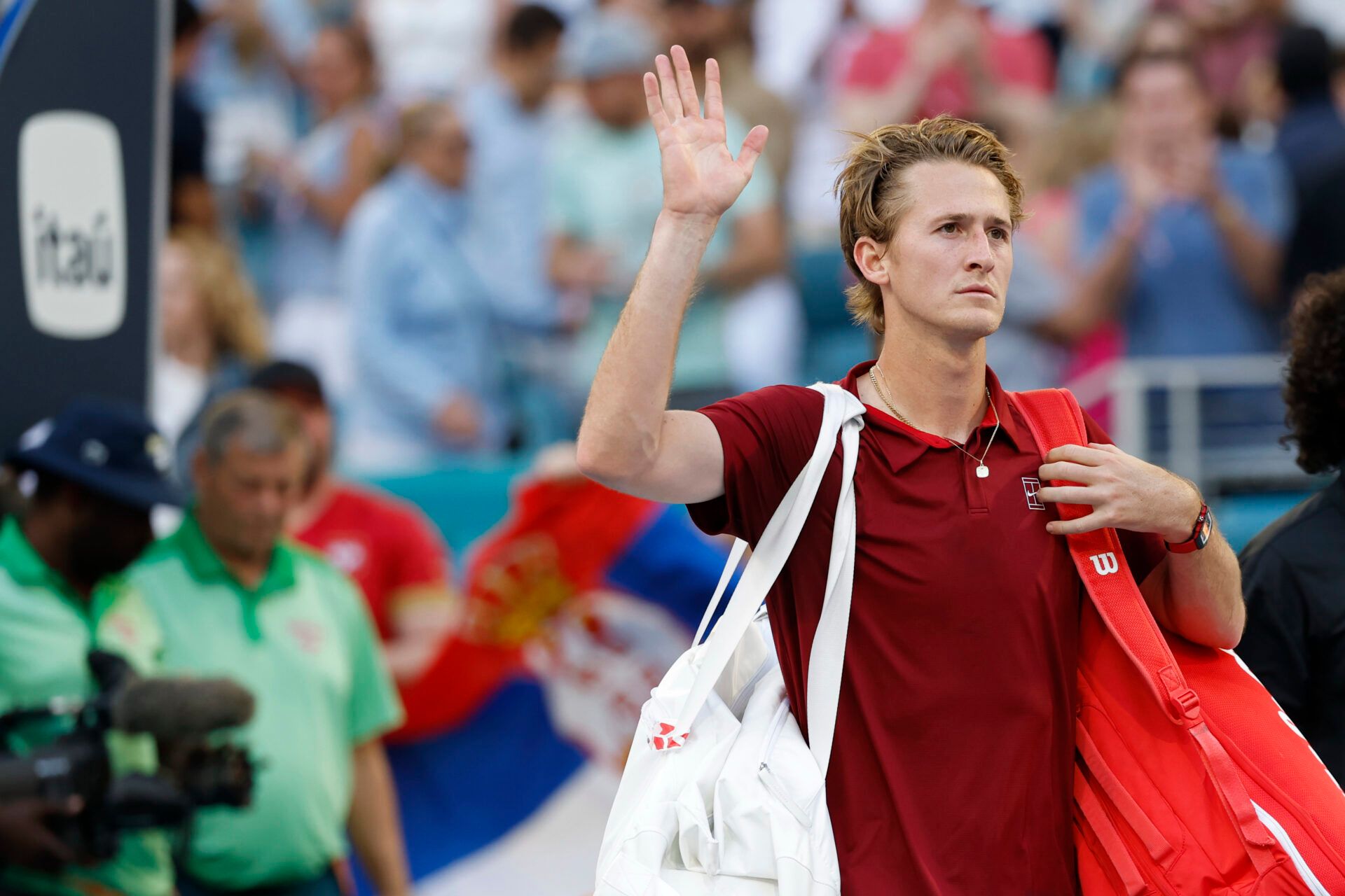 Sebastian Korda (USA) waves to fans while leaving the court after his match against Novak Djokovic (SRB)(not pictured) in a men's singles quarterfinal on day ten of the Miami Open at Hard Rock Stadium.