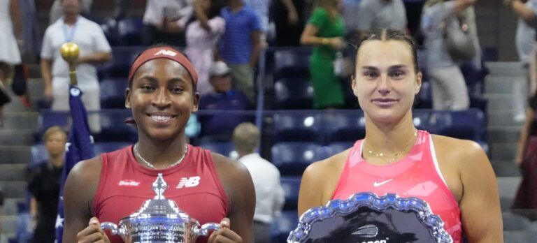 (L-R) Coco Gauff of the United States and Aryna Sabalenka celebrate with the championship and finalist trophies, respectively, after their match in the women's singles finalon day thirteen of the 2023 U.S. Open tennis tournament at USTA Billie Jean King Tennis Center.
