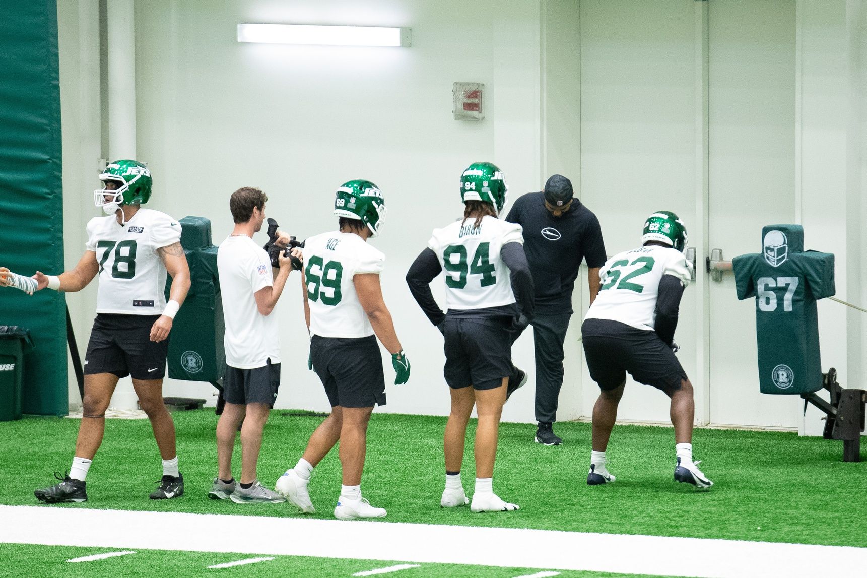 New York Jets rookie defensive lineman Tyler Baron (94) and other players participate in a drill during the minicamp at Atlantic Health Jets Training Center.