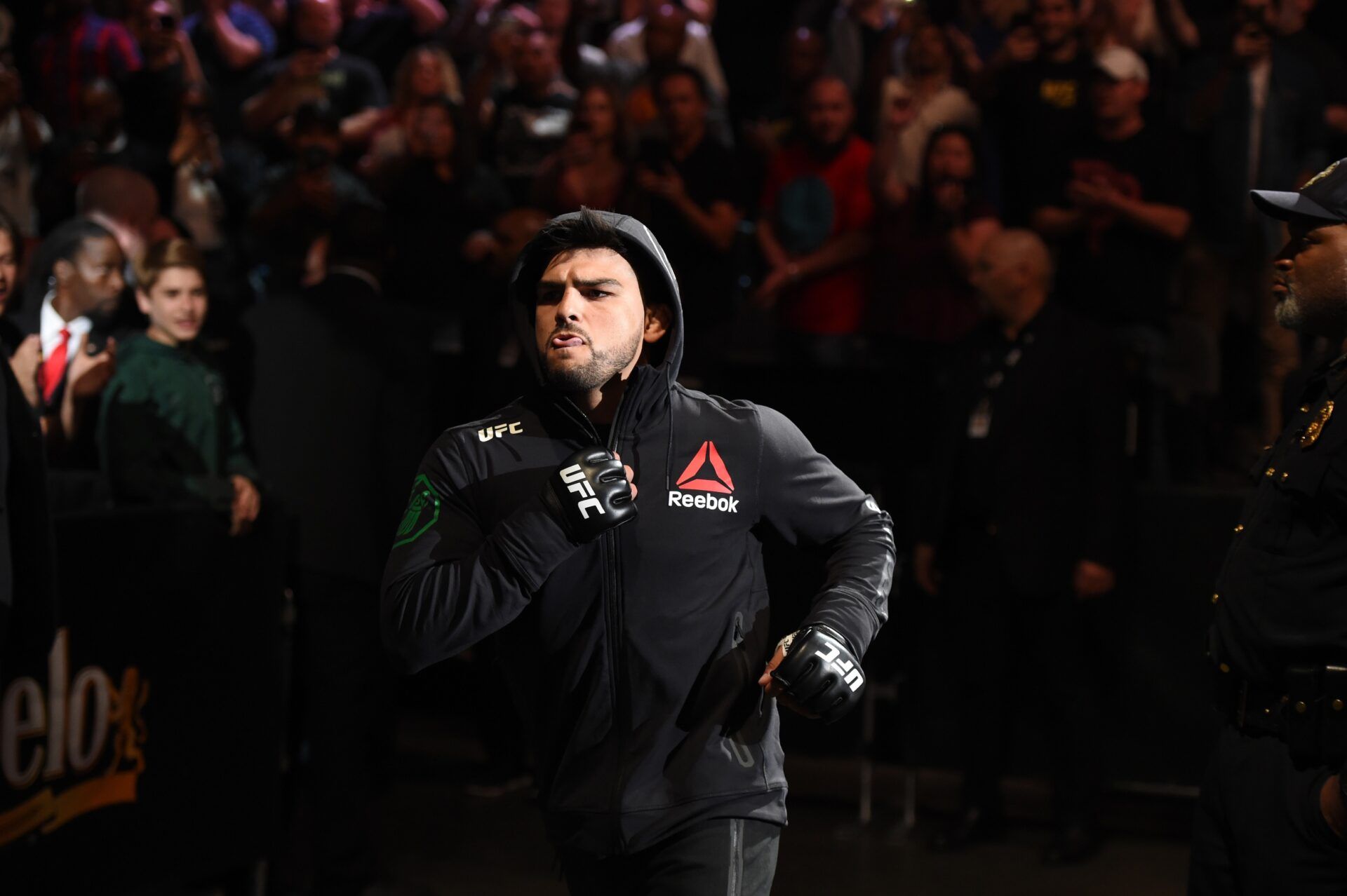 Kelvin Gastelum (red gloves) runs to the octagon before a bout against Israel Adesanya (not pictured) during UFC 236 at State Farm Arena. Adesanya won by unanimous decision.