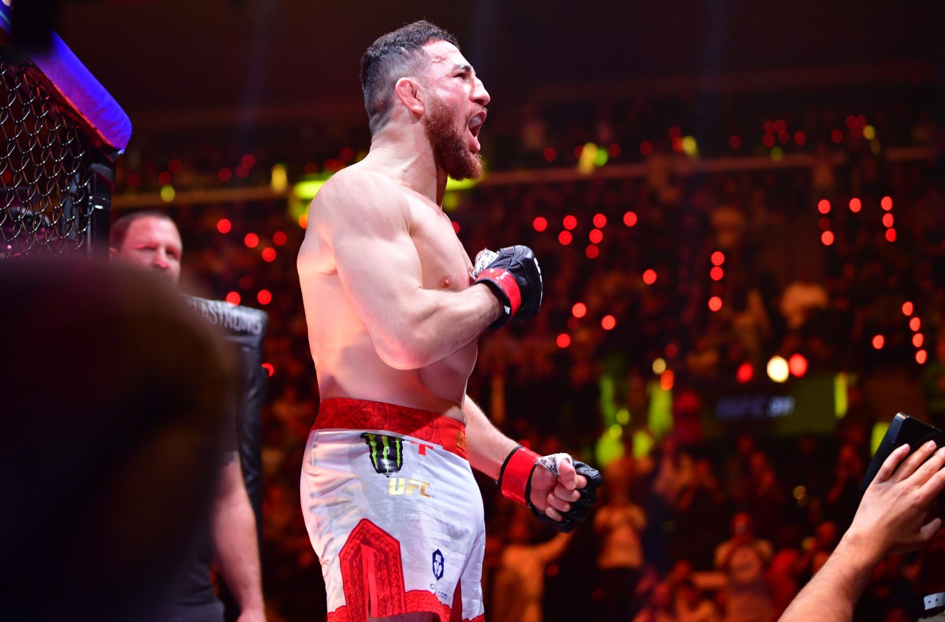 Merab Dvalishvili (red gloves) is introduced for a bout against Umar Nurmagomedov (not pictured) during UFC 311 at Intuit Dome.