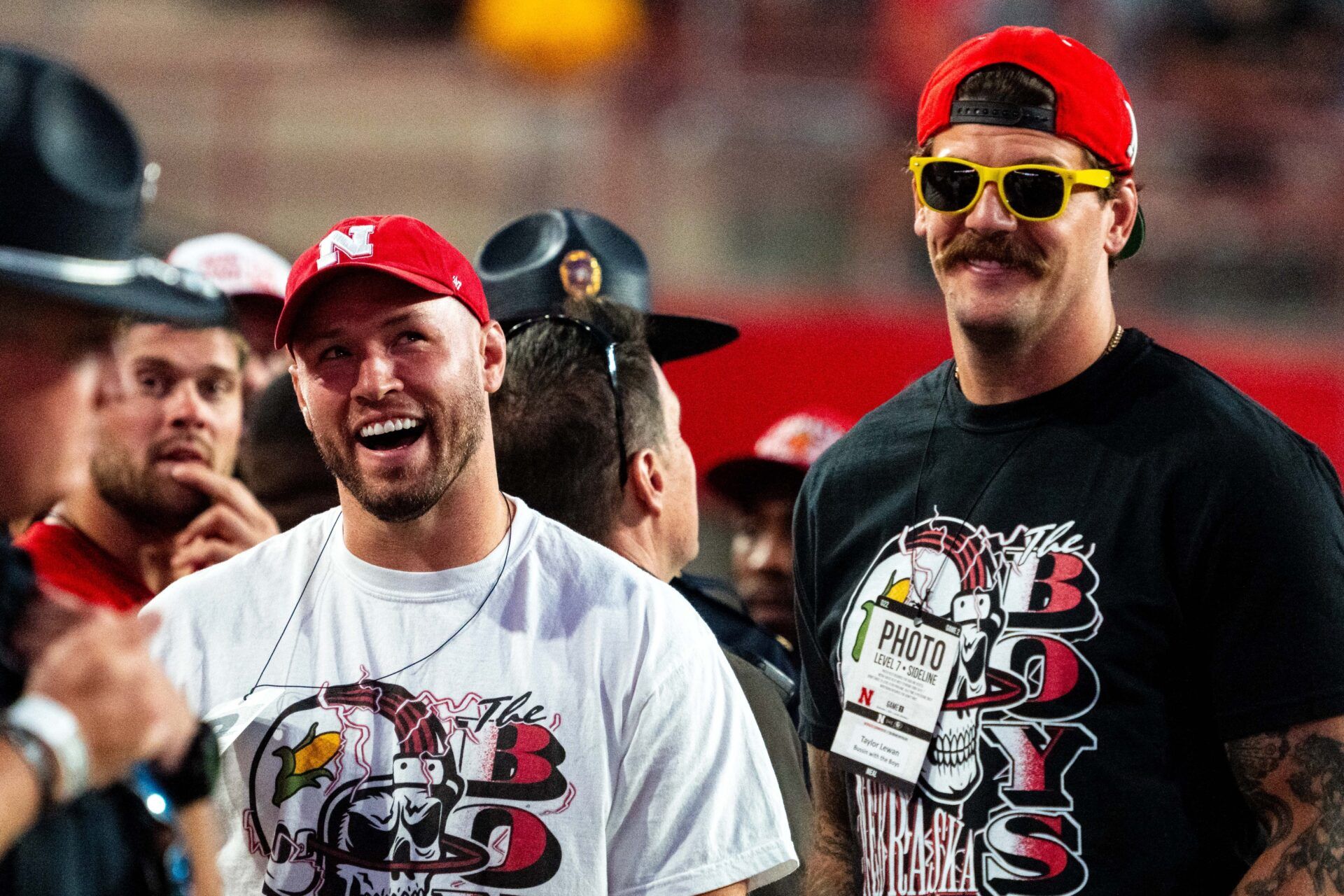 Bussin’ With The Boys’ Will Compton and Taylor Lewan stand on the sideline during the third quarter between the Nebraska Cornhuskers and the Colorado Buffaloes at Memorial Stadium.