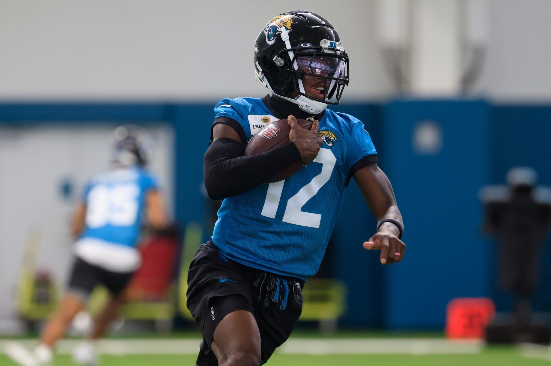 Jacksonville Jaguars wide receiver Travis Hunter (12) runs the ball during the 10th organized team activity at Miller Electric Center Wednesday, June 4, 2025 in Jacksonville, Fla. [Corey Perrine/Florida Times-Union]