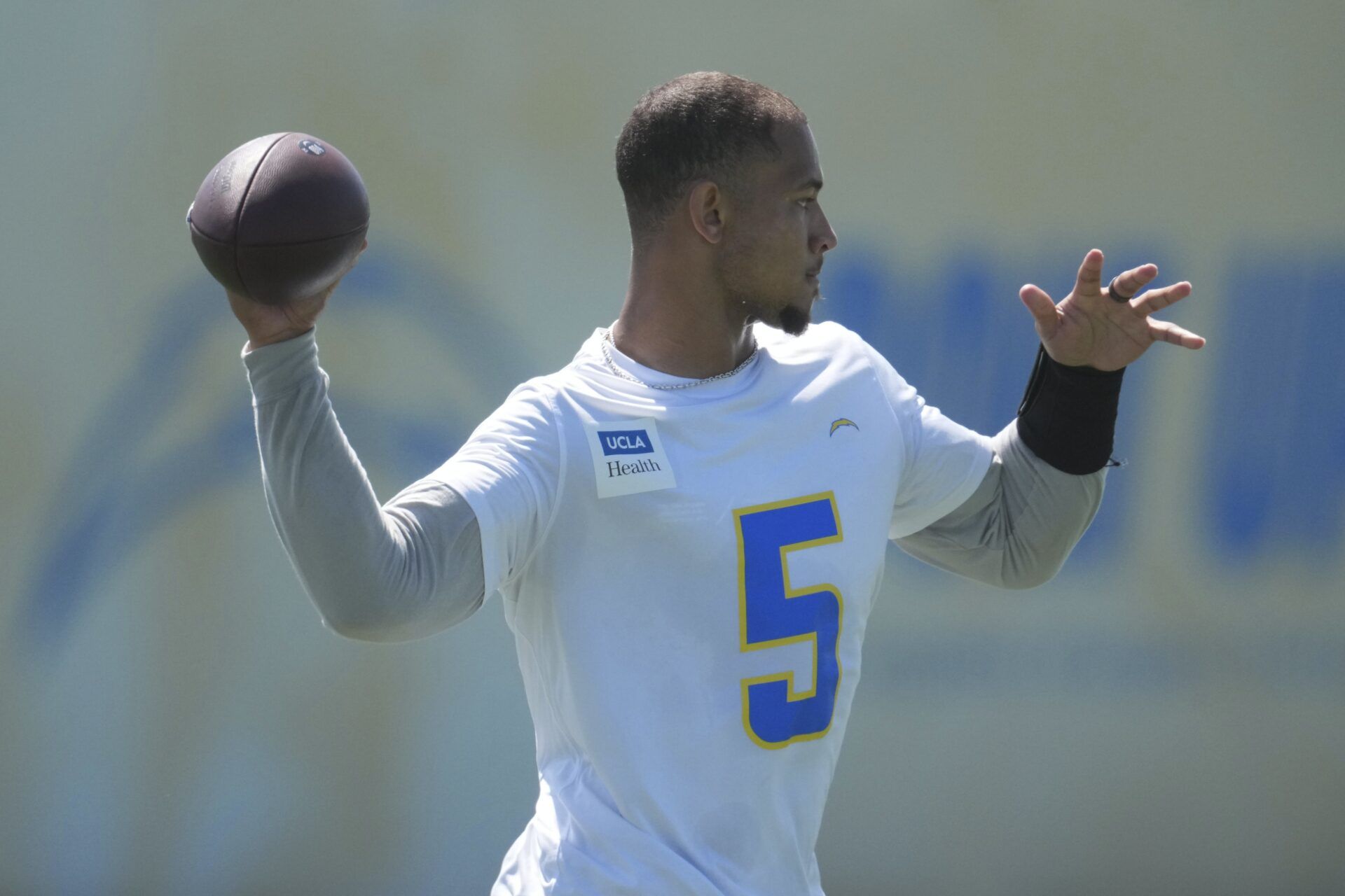 Los Angeles Chargers quarterback Trey Lance (5) throws the ball during offseason workouts at The Bolt.