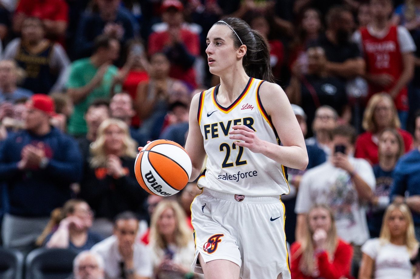 Indiana Fever guard Caitlin Clark (22) dribbles the ball  in the second half against the New York Liberty at Gainbridge Fieldhouse.
