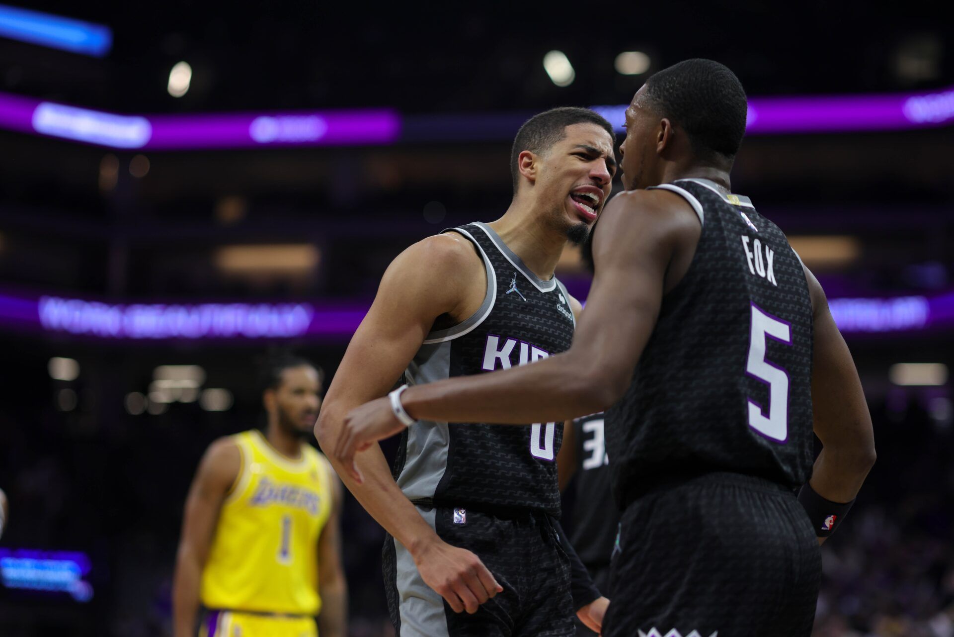 Sacramento Kings guard De'Aaron Fox (5) is congratulated by guard Tyrese Haliburton (0) during the third quarter against the Los Angeles Lakers at Golden 1 Center.