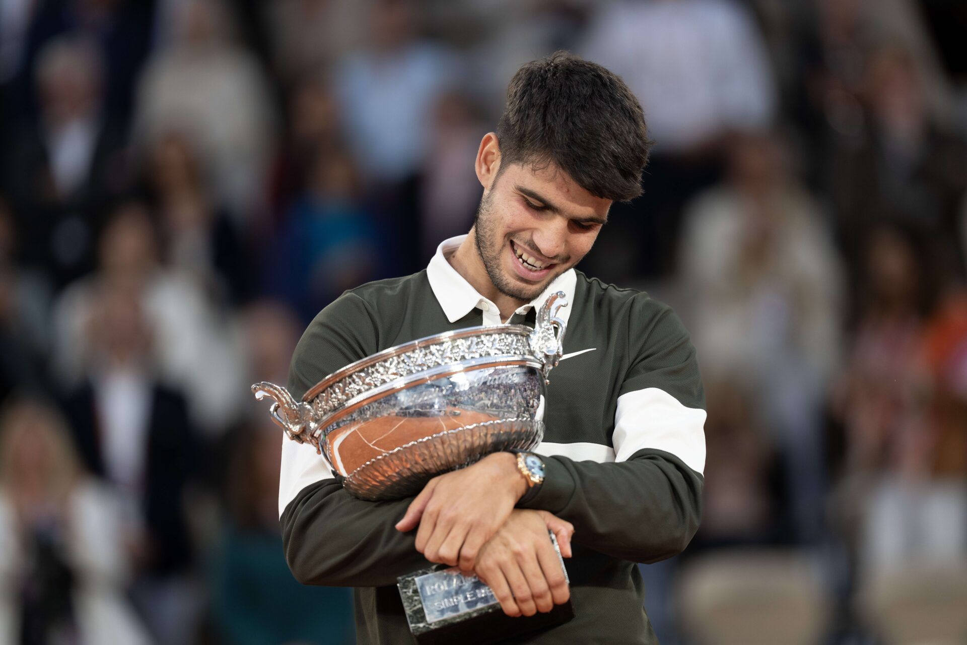Carlos Alcaraz of Spain poses with the trophy after winning the men’s singles final against Jannik Sinner of Italy on day 15 at Roland Garros Stadium.