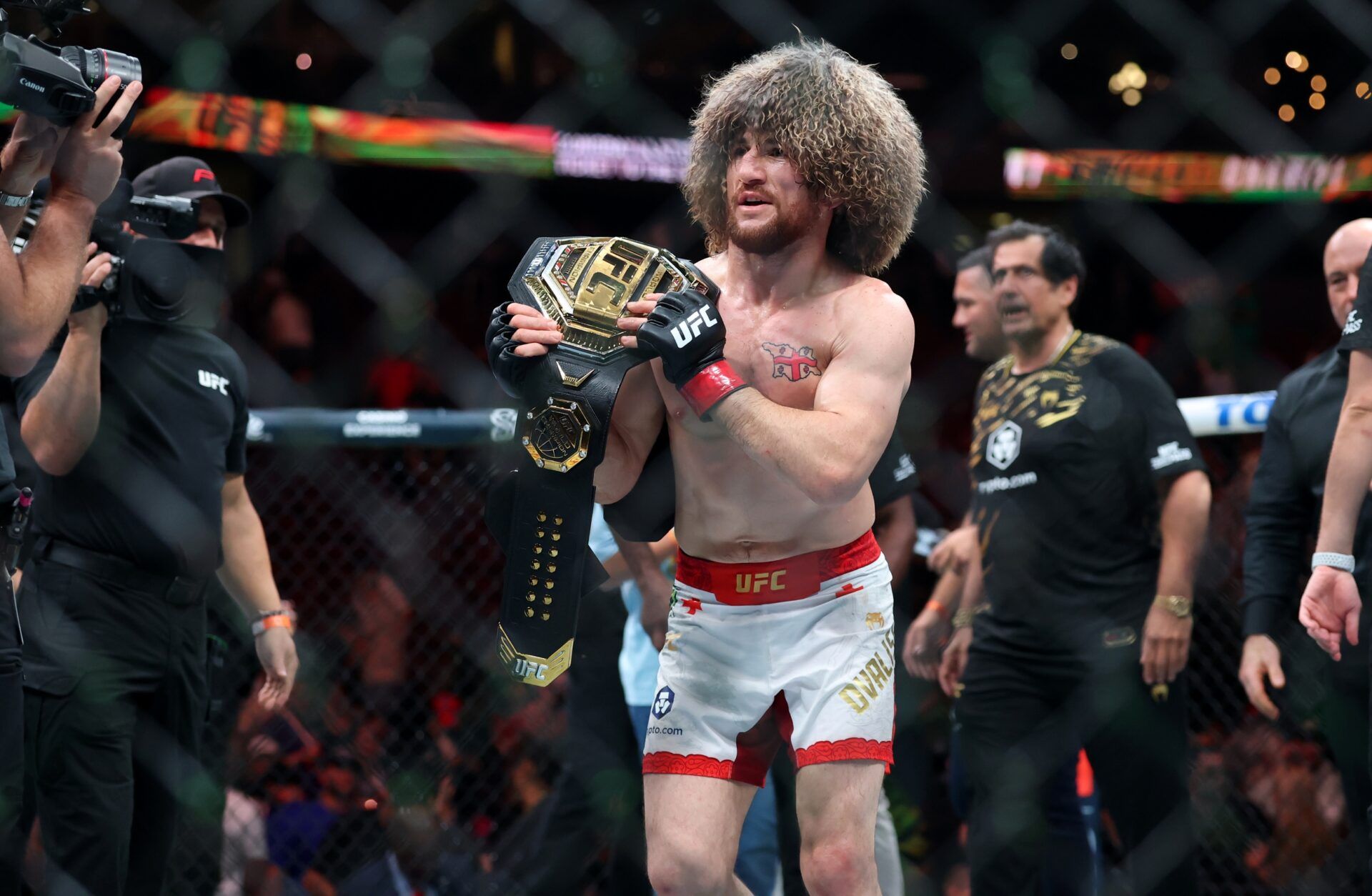 Merab Dvalishvili (red gloves) reacts after defeating Sean O’Malley (not pictured) in a bantamweight title fight during UFC 316 at Prudential Center.