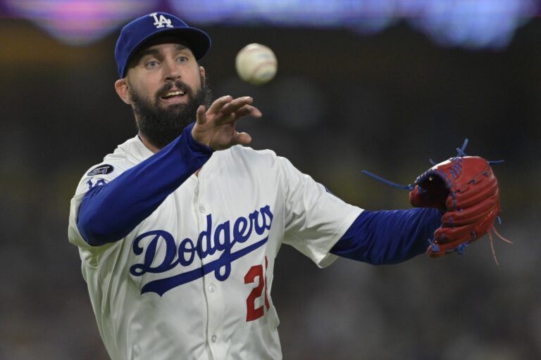 Los Angeles Dodgers starting pitcher Tony Gonsolin (26) throws New York Mets catcher Luis Torrens (13) out at first in the fifth inning at Dodger Stadium.