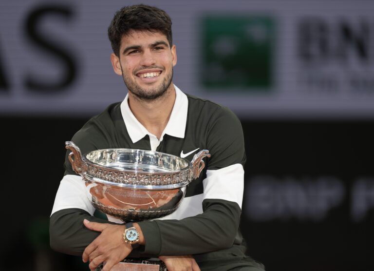 Carlos Alcaraz of Spain poses with the trophy after winning the men’s singles final against Jannik Sinner of Italy on day 15 at Roland Garros Stadium.