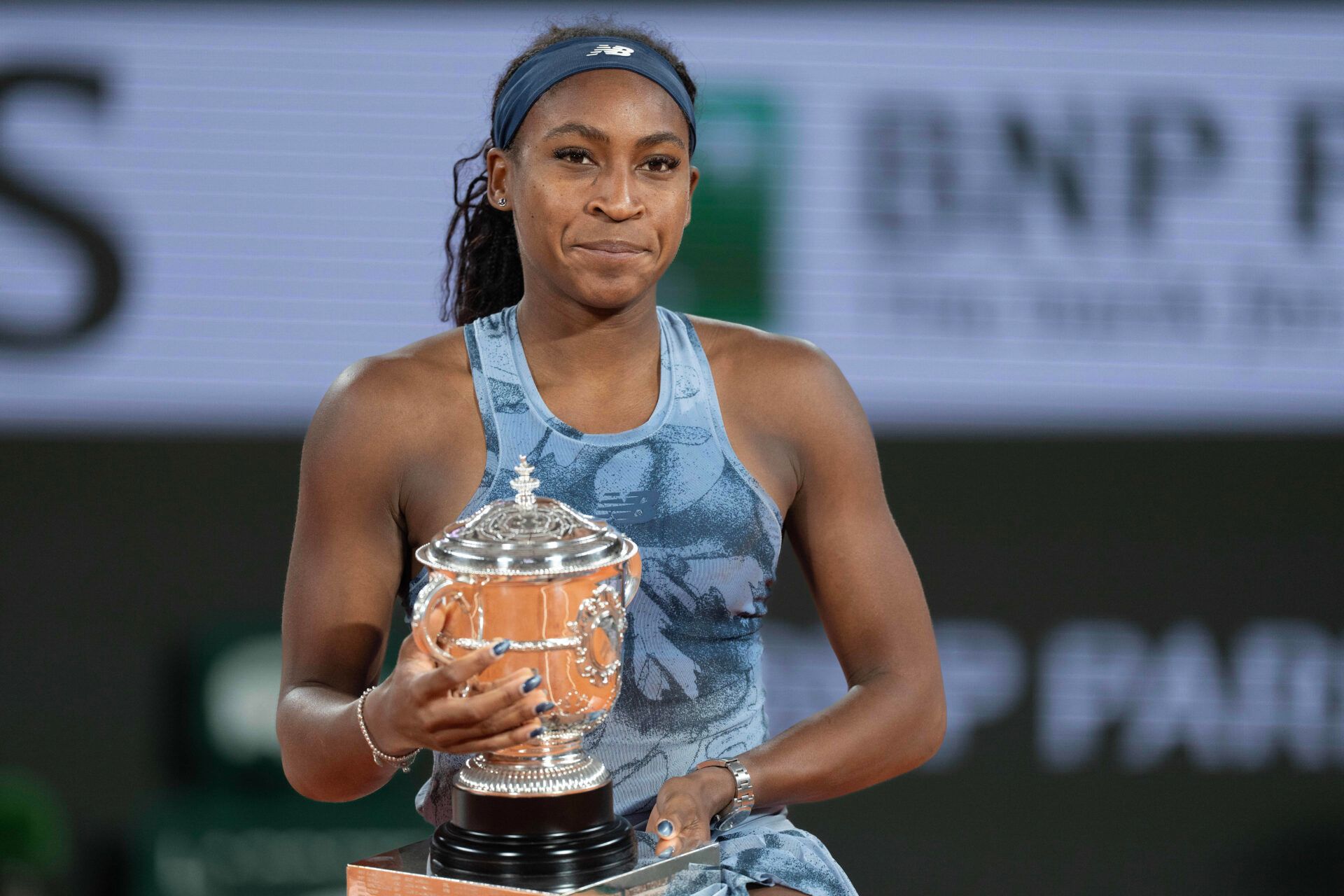 Coco Gauff of the United States poses with the trophy after winning the womens singles final against Aryna Sabalenka on day 14 at Roland Garros Stadium.