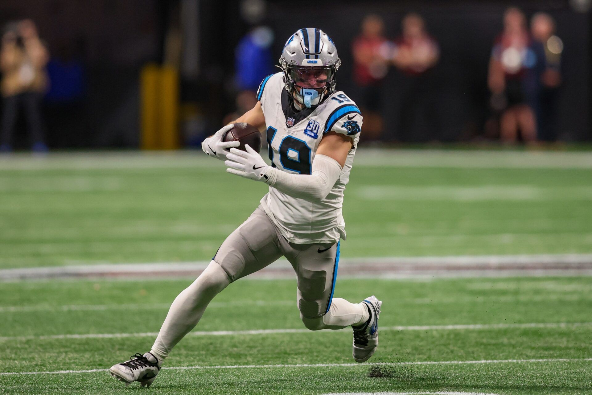 Carolina Panthers wide receiver Adam Thielen (19) runs after a catch against the Atlanta Falcons in overtime at Mercedes-Benz Stadium.