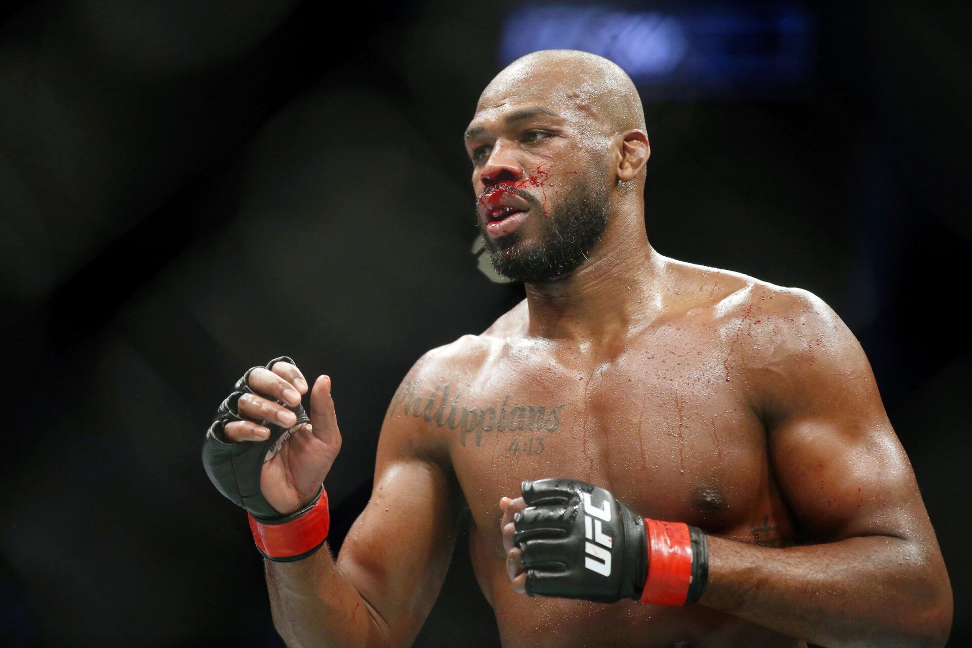 Jon Jones (red gloves) fights Dominick Reyes (not pictured) during UFC 247 at Toyota Center.