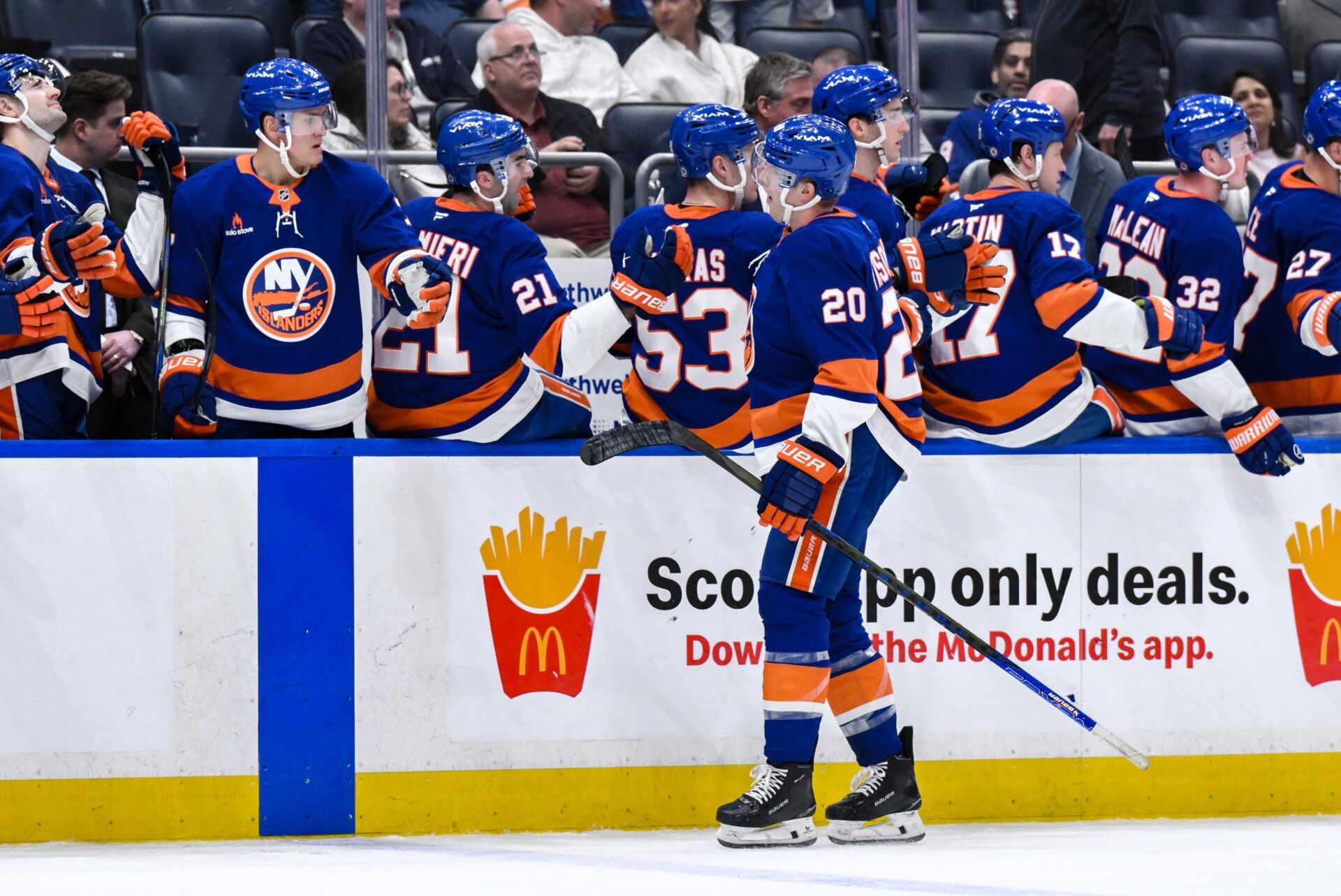 New York Islanders right wing Hudson Fasching (20) celebrates with teammates after scoring a goal against the Washington Capitals during the third period at UBS Arena.
