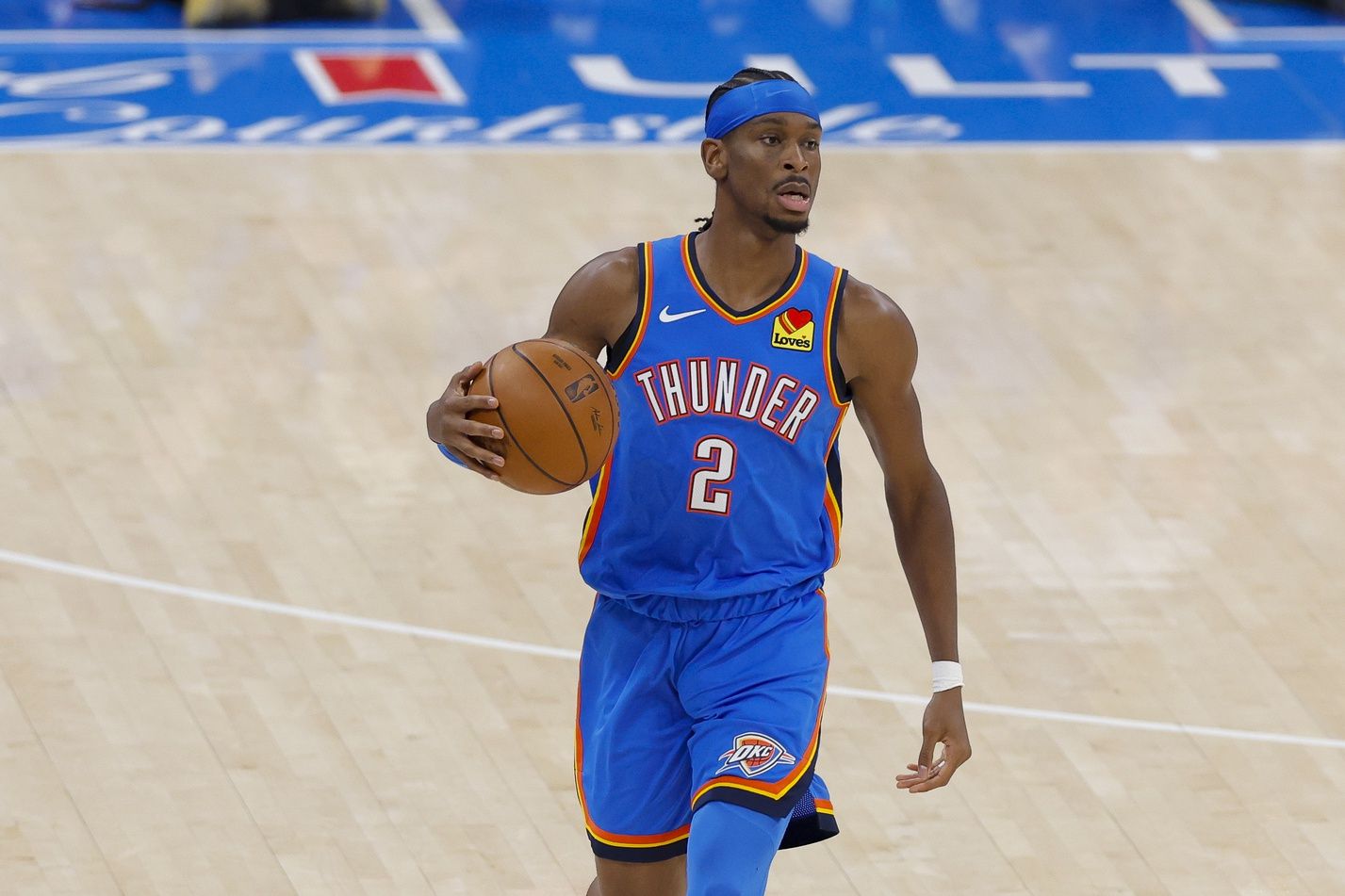 Oklahoma City Thunder guard Shai Gilgeous-Alexander (2) brings the ball up court against the Indiana Pacers during the first quarter of game two of the 2025 NBA Finals at Paycom Center.