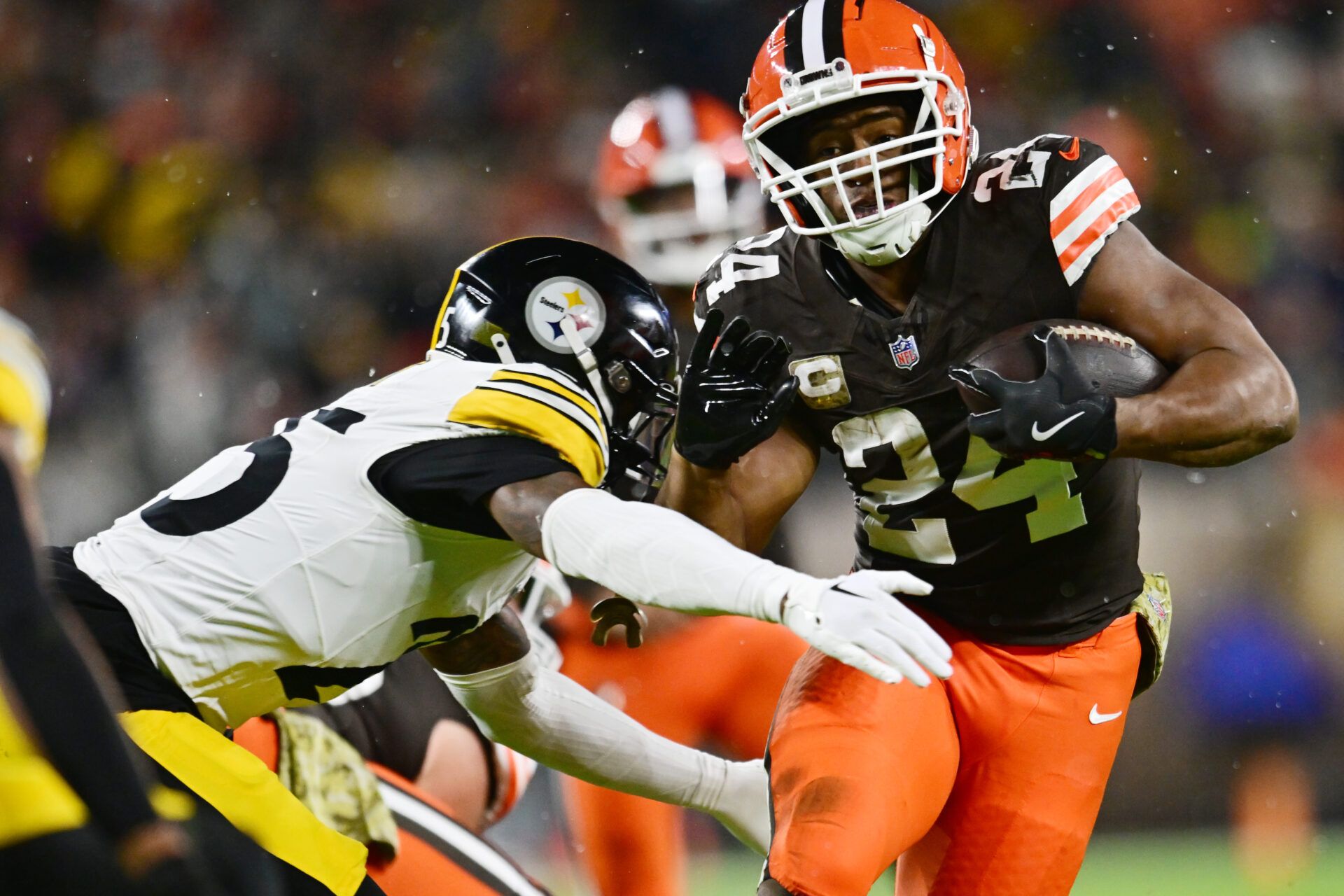 Cleveland Browns running back Nick Chubb (24) runs with the ball against Pittsburgh Steelers safety DeShon Elliott (25) during the first half at Huntington Bank Field.