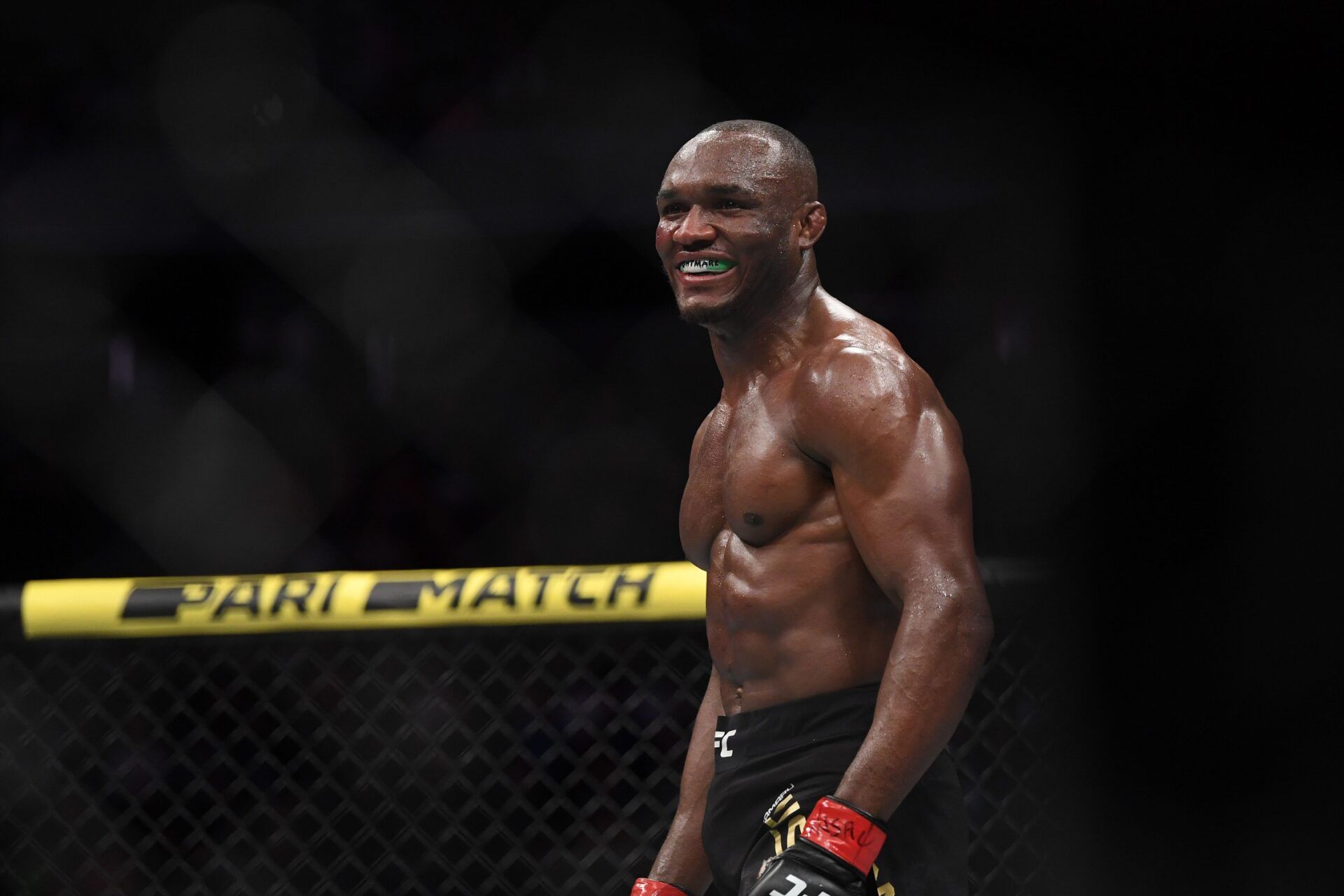 Kamaru Usman (red gloves) reacts after defeating Colby Covington (not pictured) during UFC 245 at T-Mobile Arena.
