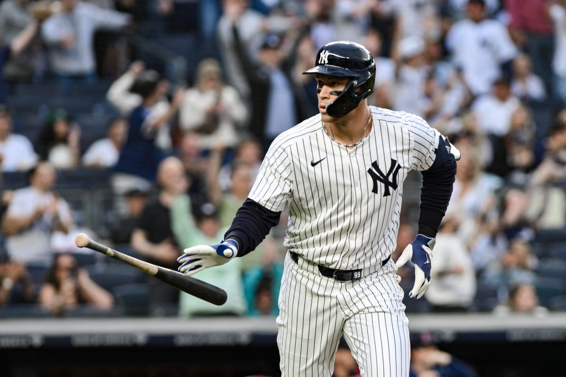 New York Yankees outfielder Aaron Judge (99) reacts after hitting a two-run home run against the Boston red Sox during the first inning at Yankee Stadium.