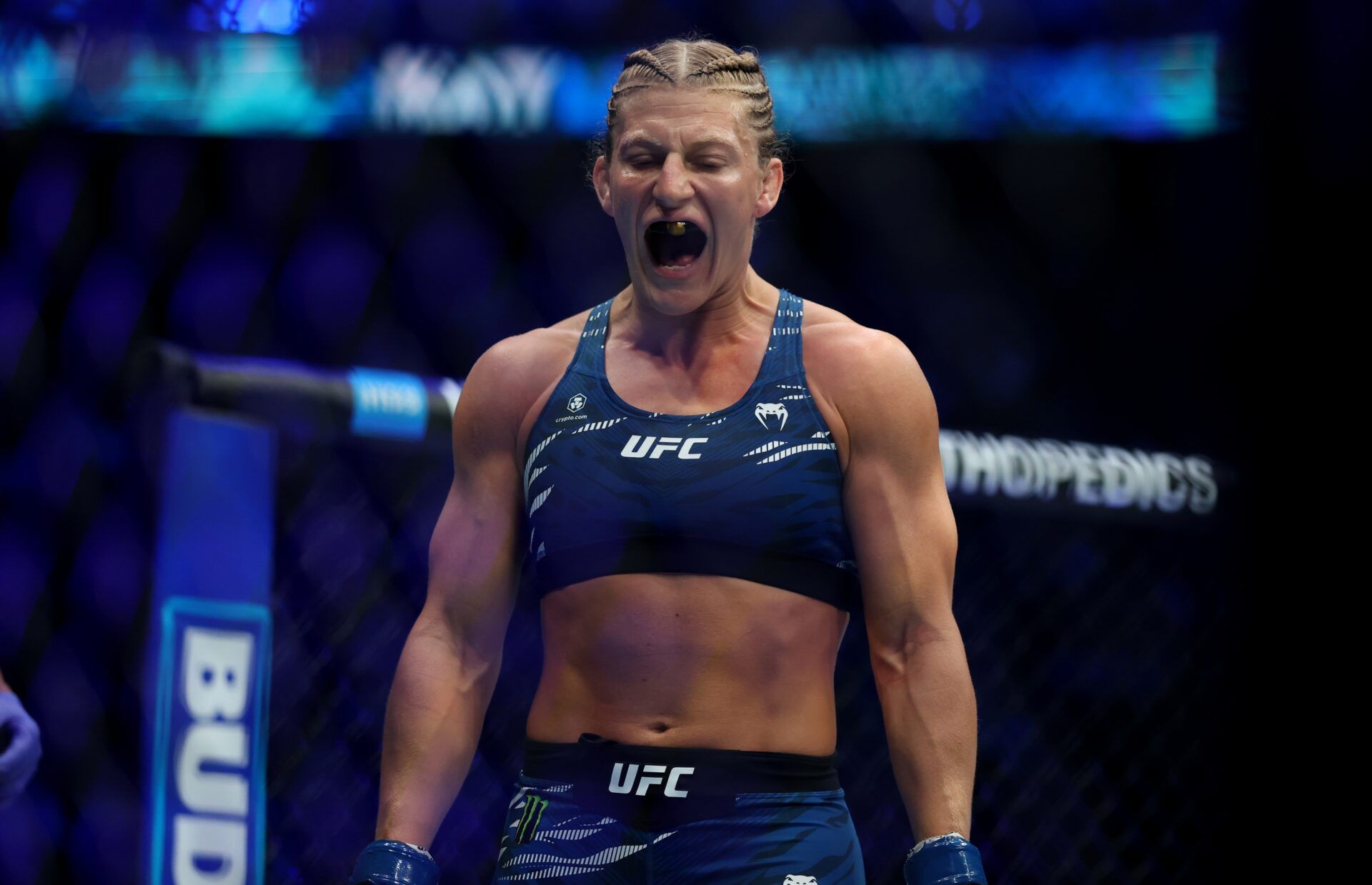 Kayla Harrison (blue gloves) prepares to fight Julianna Pena (not pictured) in a bantamweight title bout during UFC 316 at Prudential Center.