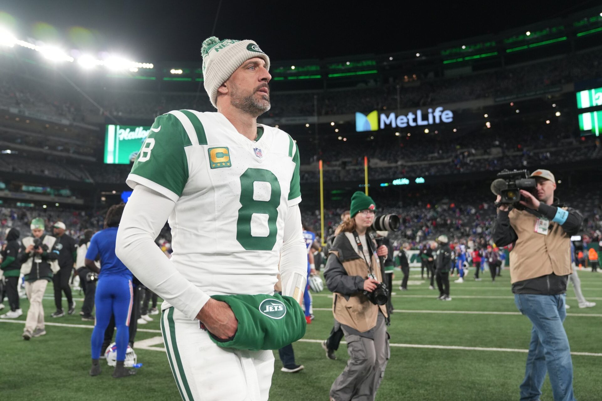 New York Jets quarterback Aaron Rodgers (8) exits the field after the game against the Buffalo Bills at MetLife Stadium.