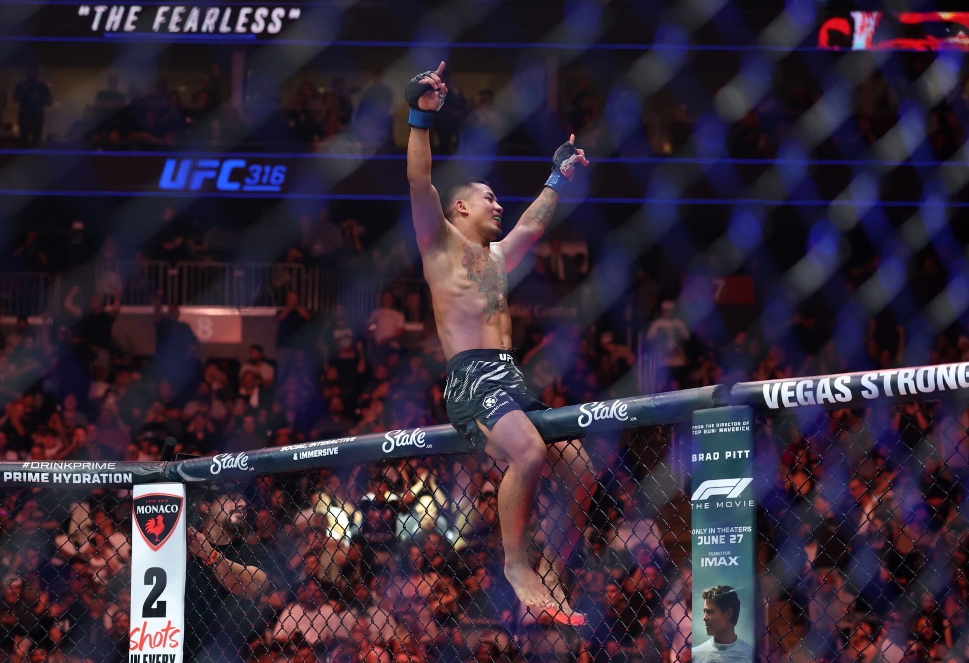Joshua Van (blue gloves) reacts after defeating Bruno Silva (not pictured) during UFC 316 at Prudential Center.
