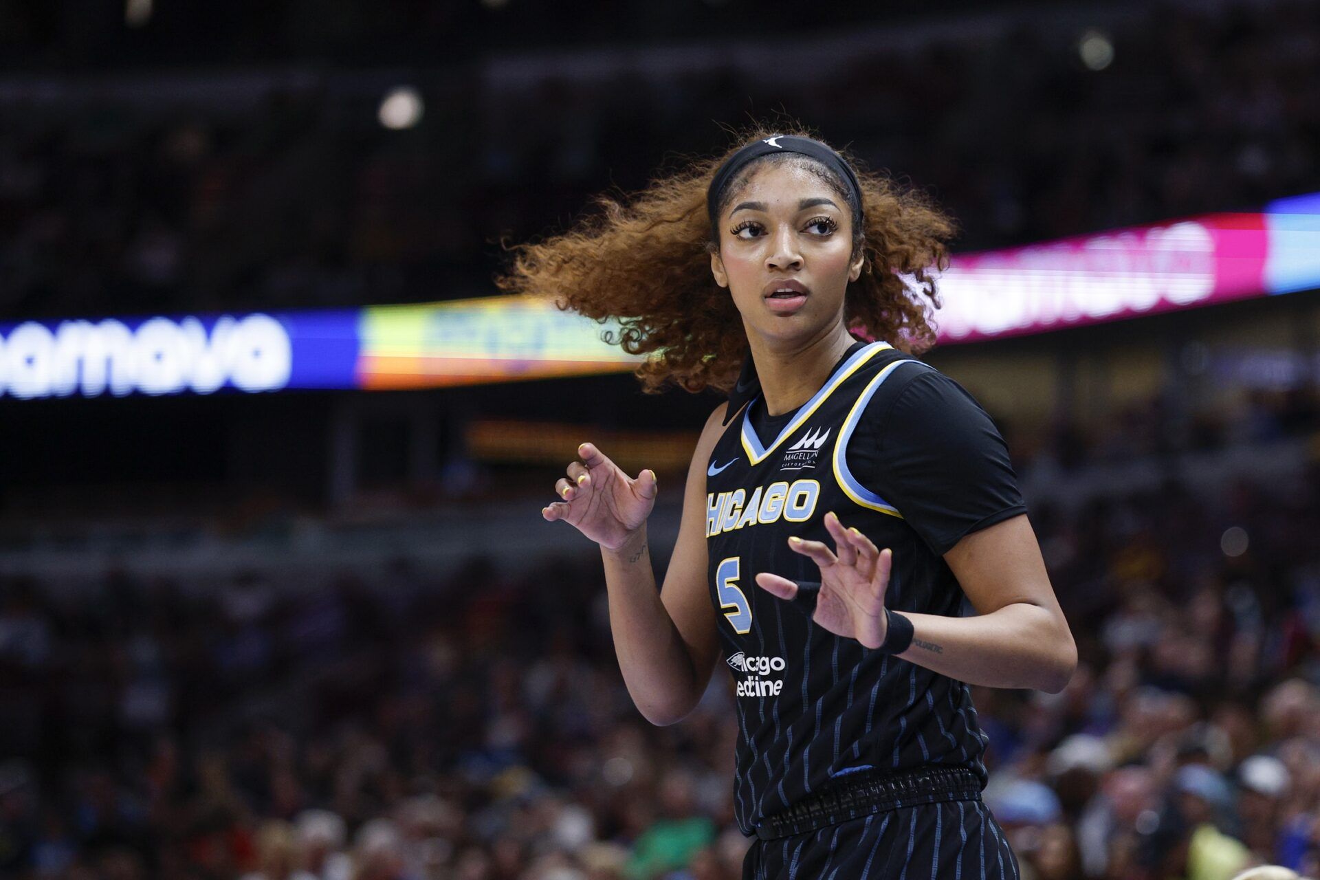 Chicago Sky forward Angel Reese (5) reacts during the first half of a WNBA game against the Chicago Sky at United Center.