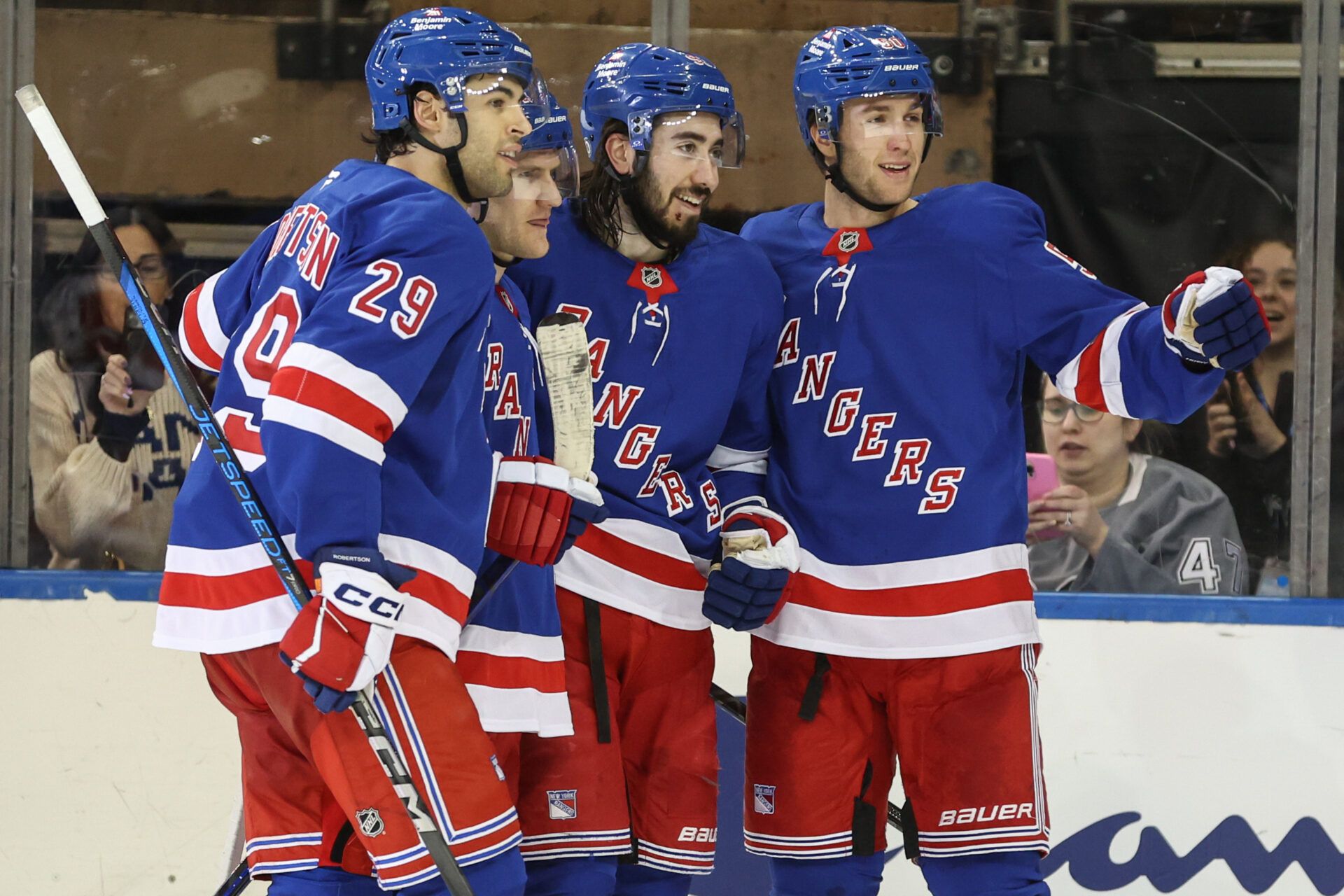 New York Rangers center Mika Zibanejad (93) celebrates with his teammates after scoring a goal after scoring a goal in the third period against the Tampa Bay Lightning at Madison Square Garden.