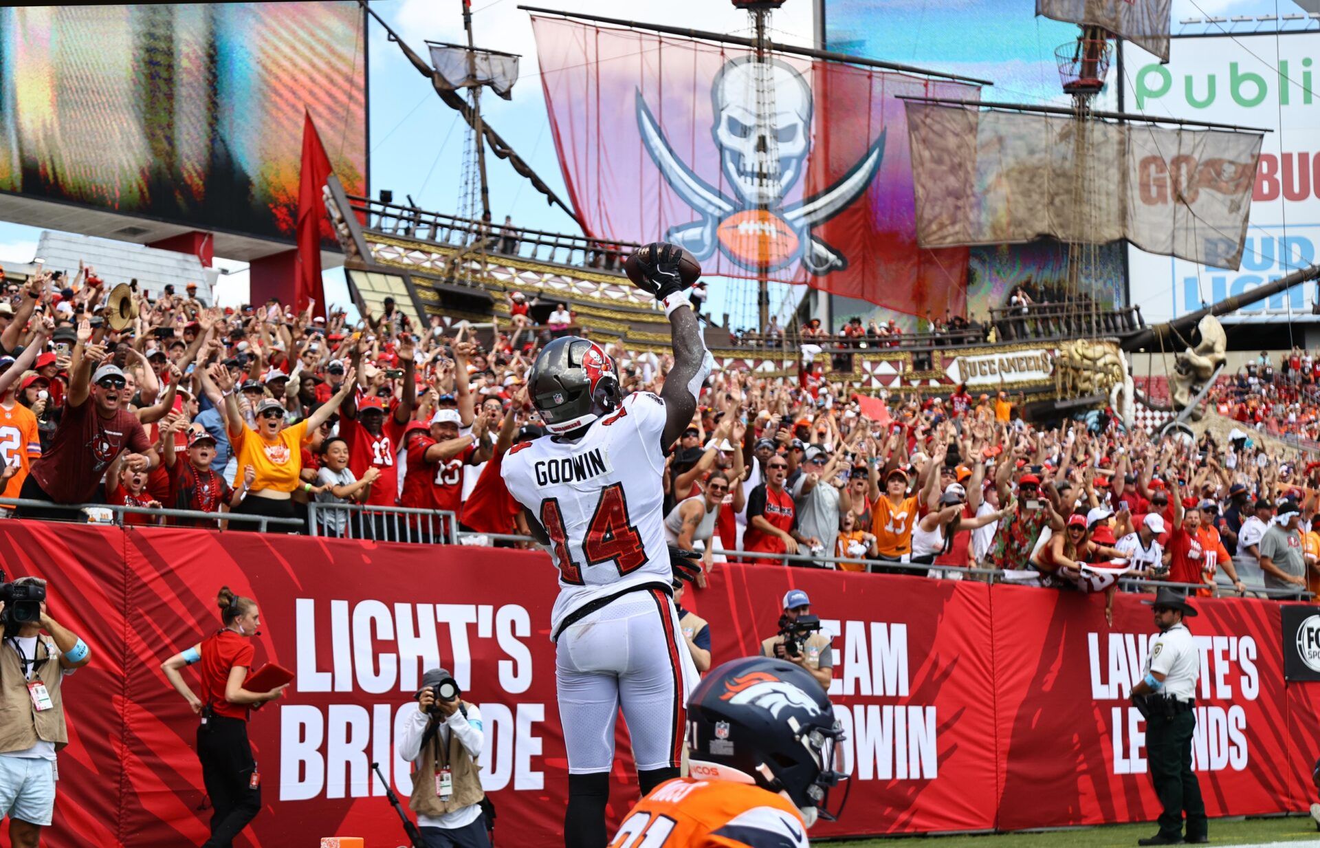 Tampa Bay Buccaneers wide receiver Chris Godwin (14) celebrates after he scored a touchdown against the Denver Broncos during the first half at Raymond James Stadium.