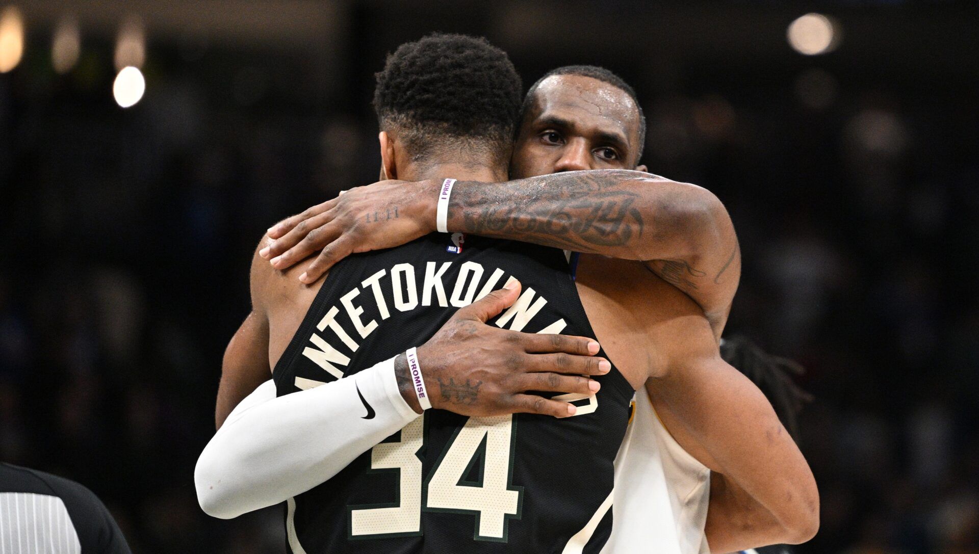 Los Angeles Lakers forward LeBron James (6) and Milwaukee Bucks forward Giannis Antetokounmpo (34) exchange hugs after the Los Angeles Lakers 133-129 win over the Milwaukee Bucks at Fiserv Forum.