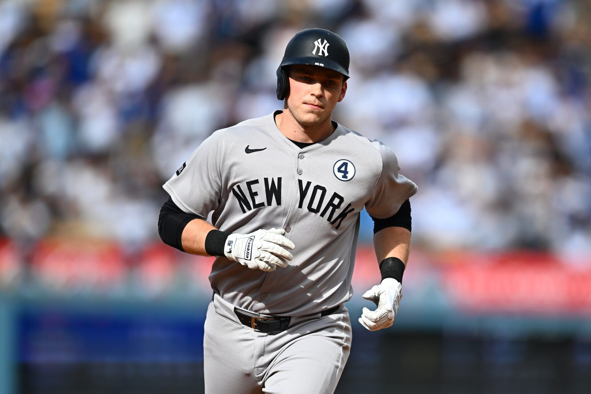 New York Yankees designated hitter Ben Rice (22) rounds the bases on a two-run home run against the Los Angeles Dodgers during the third inning at Dodger Stadium.