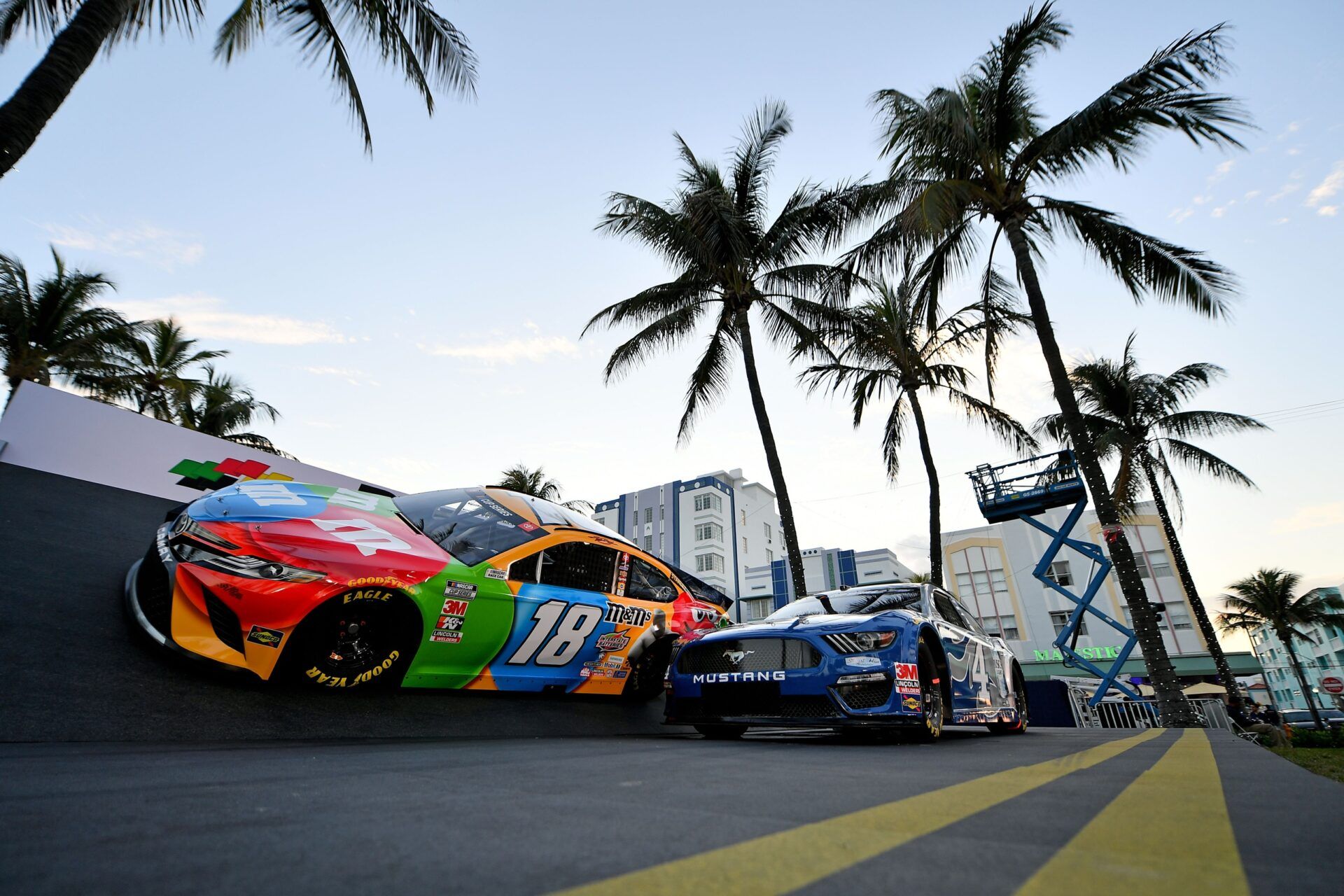 The cars of NASCAR cup series driver Kyle Busch and Kevin Harvick parked in an advertisement for the 2020 Daytona 500 sit off Ocean drive in South Beach Miami prior to Super Bowl LIV between the San Francisco 49ers at Kansas City Chiefs.