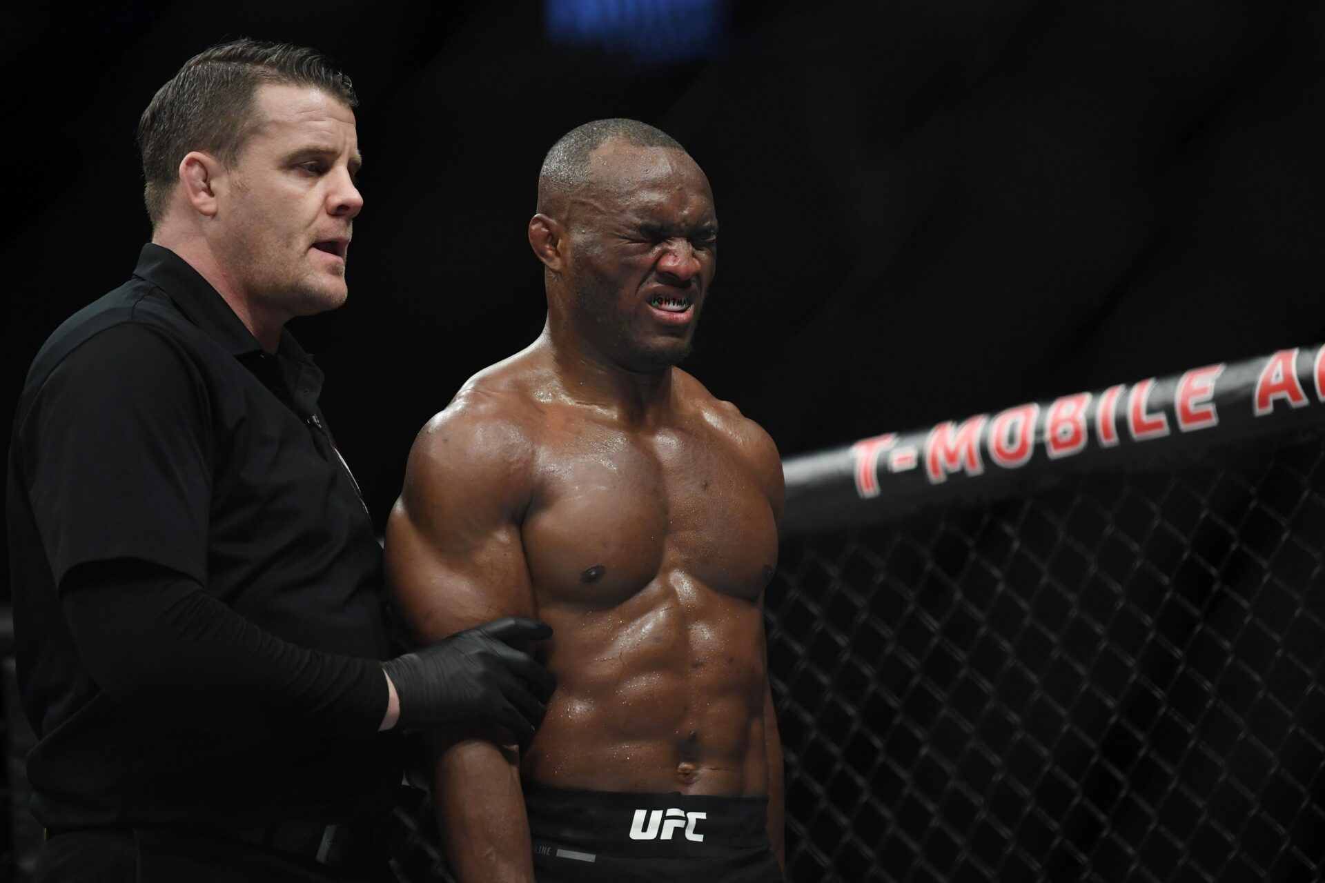 Kamaru Usman (red gloves) reacts during his bout against Colby Covington (not pictured) during UFC 245 at T-Mobile Arena.