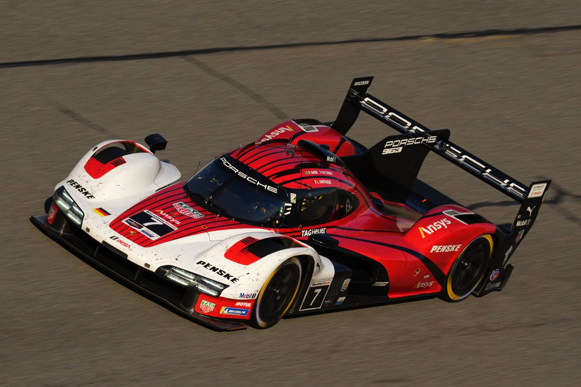 Porsche Penske Motorsport Porsche 963 of Nick Tandy, Laurens Vanthoor, and  Felipe Nasr (7) races during the Rolex 24 at Daytona International Speedway.