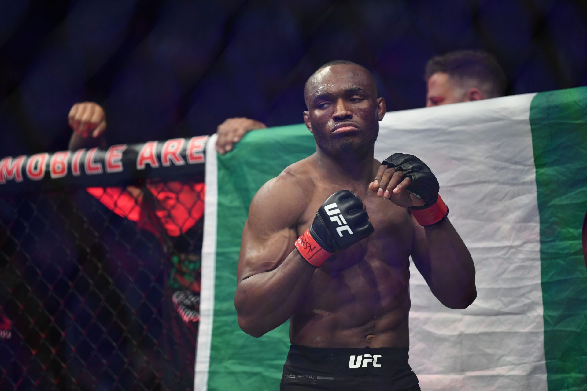 Kamaru Usman (red gloves) reacts before a bout against Colby Covington (not pictured) during UFC 245 at T-Mobile Arena.
