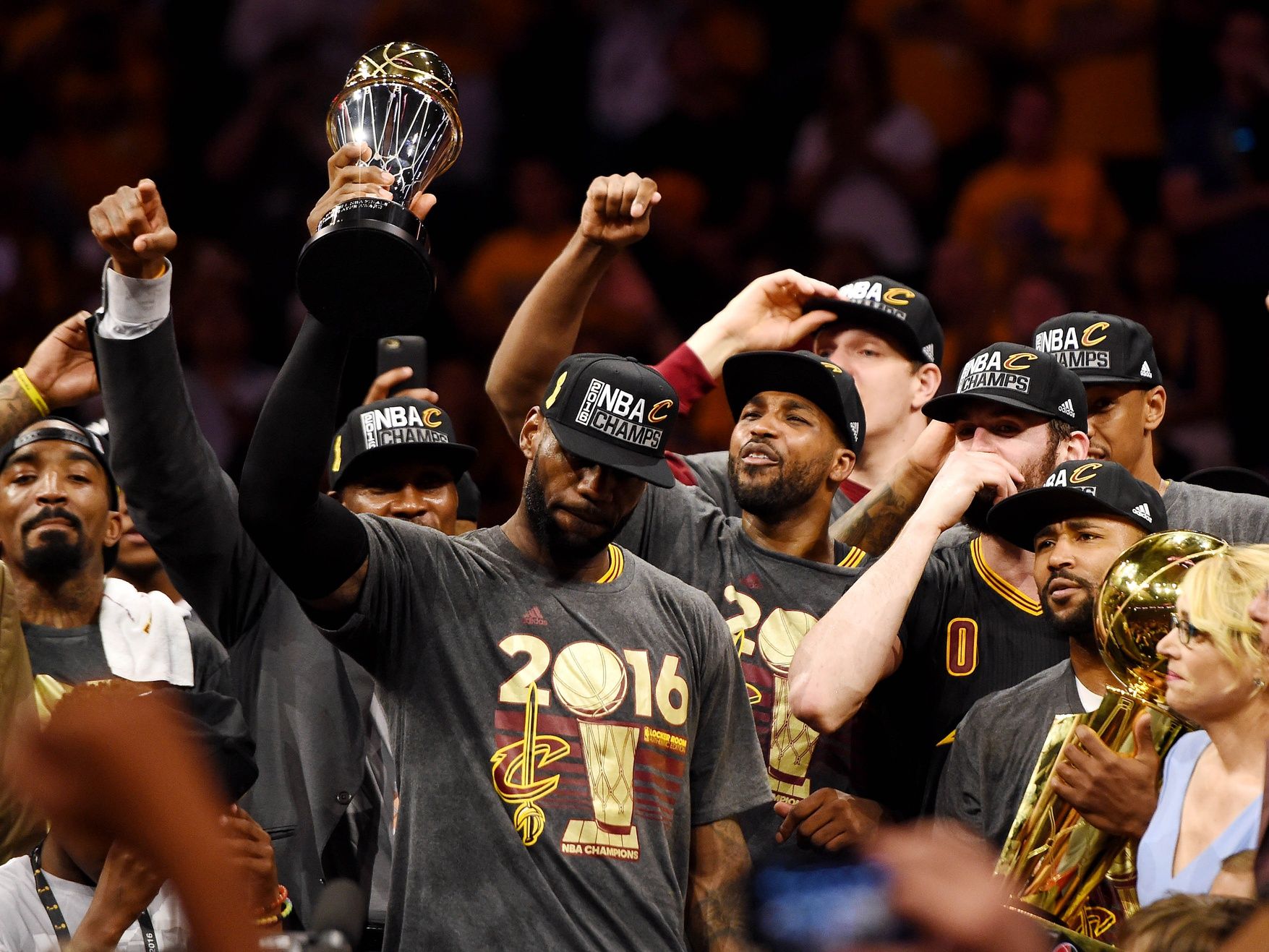 Cleveland Cavaliers forward LeBron James (23) celebrates with the Bill Russell MVP Trophy after beating the Golden State Warriors in game seven of the NBA Finals at Oracle Arena.