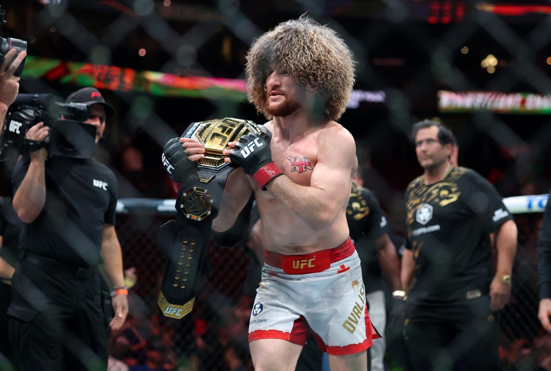 Merab Dvalishvili (red gloves) reacts after defeating Sean O’Malley (not pictured) in a bantamweight title fight during UFC 316 at Prudential Center.