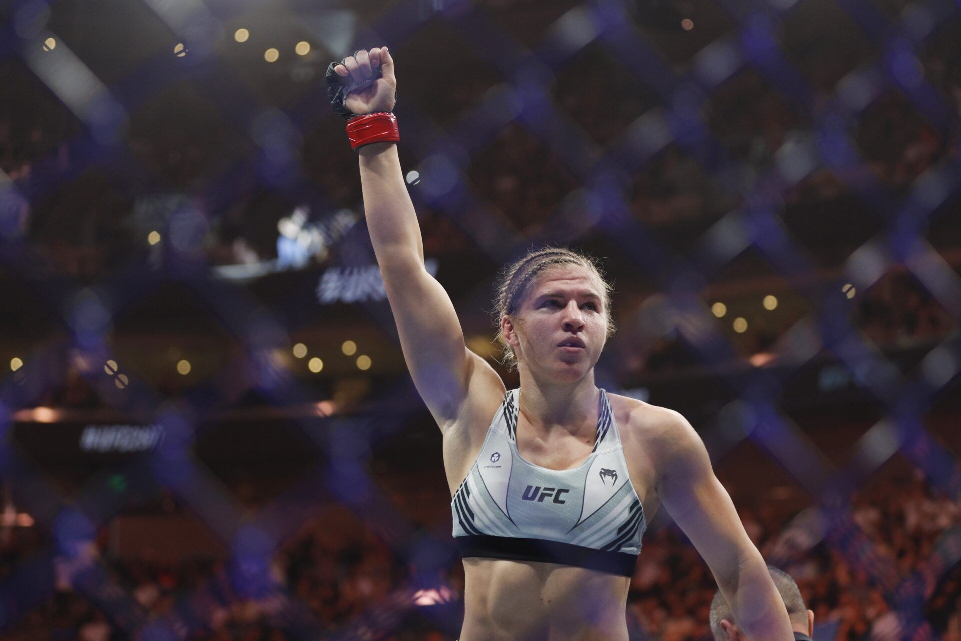 Miranda Maverick (red gloves) reacts to defeating Priscila Capoeira (blue gloves) during UFC 291 at Delta Center.