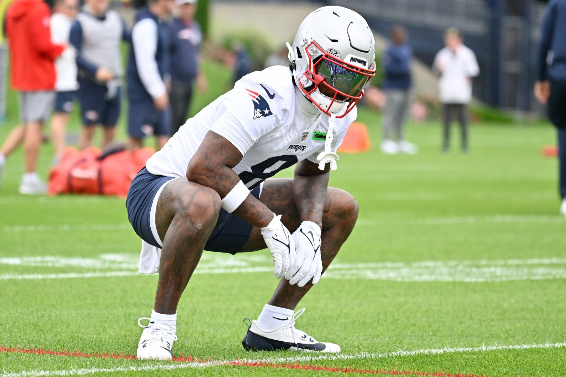 New England Patriots wide receiver Stefon Diggs (8) stretches during minicamp at Gillette Stadium.